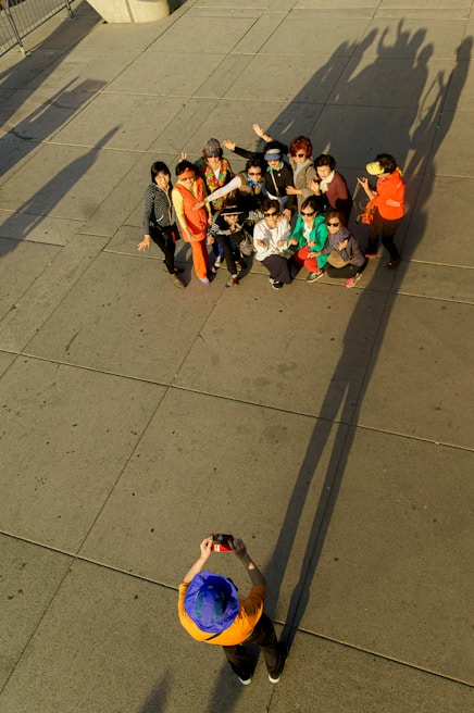 A group of people posing for a photo outdoors.