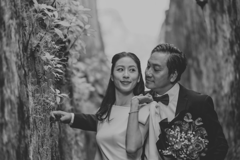 Couple in formal wear with flowers