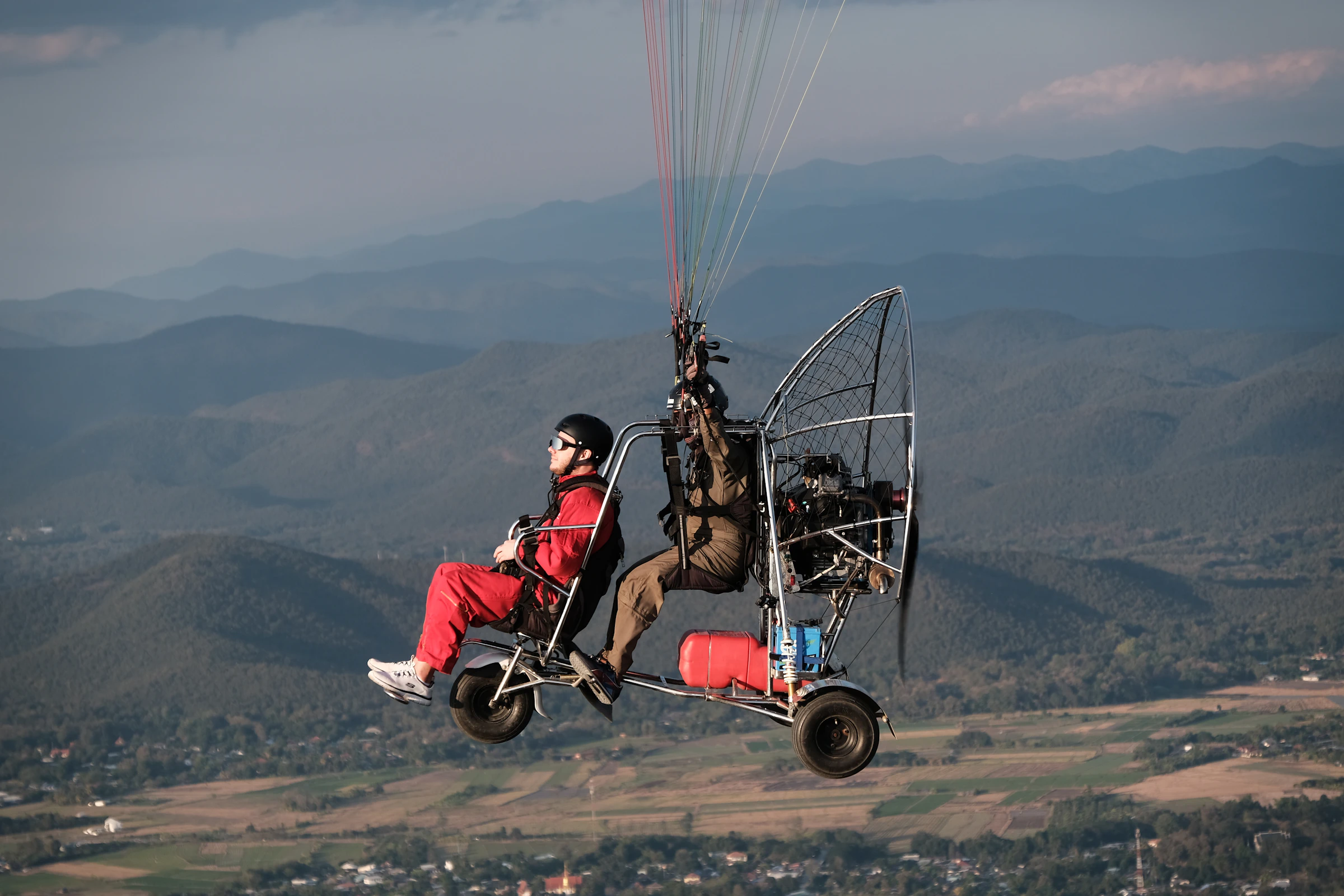 Paramotor flight over the northern Thai highlands at golden hour