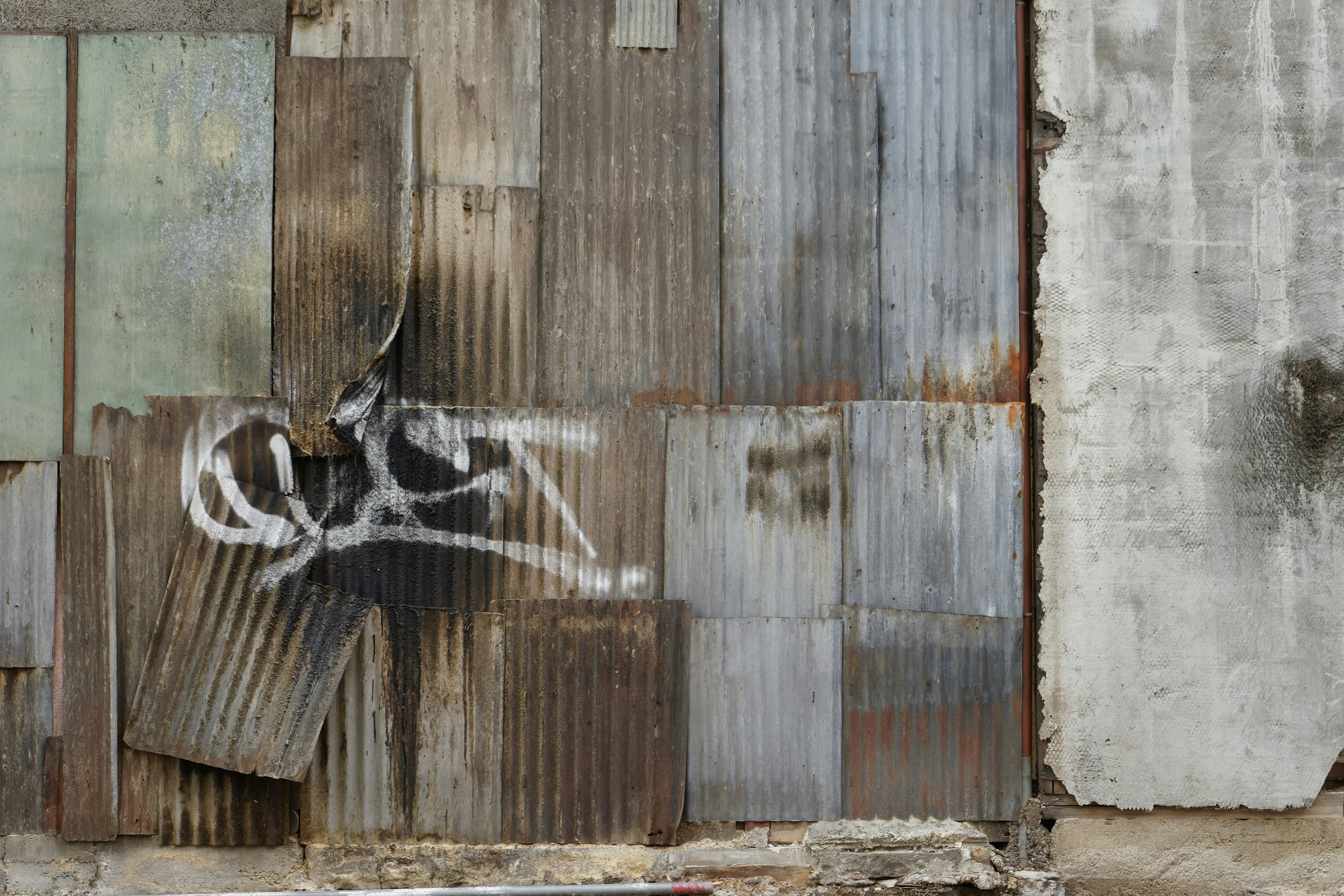 Corrugated metal wall with graffiti art
