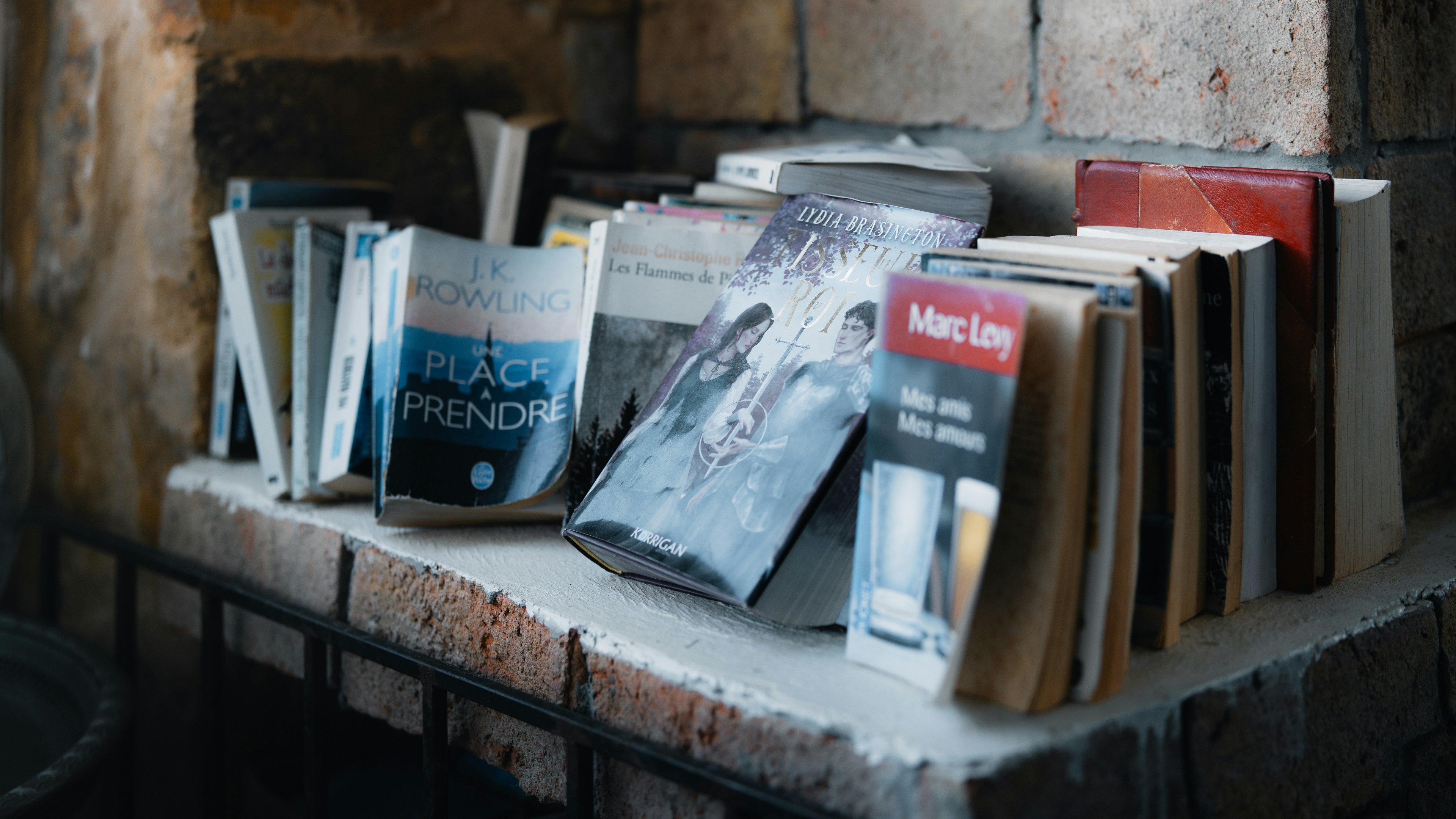 A shelf filled with old books and magazines