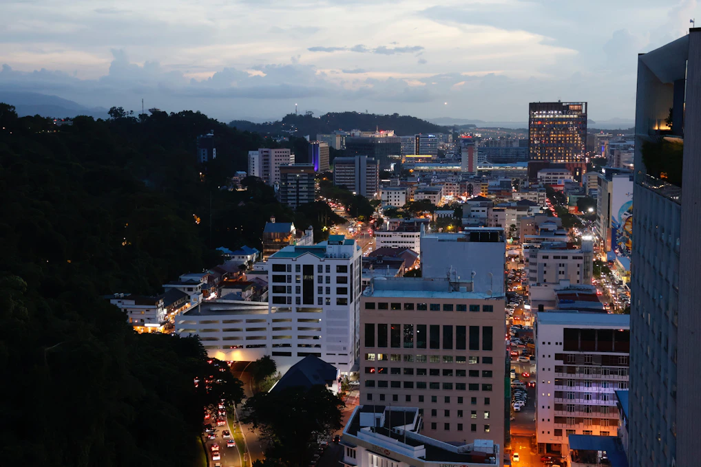 City skyline with buildings illuminated at dusk