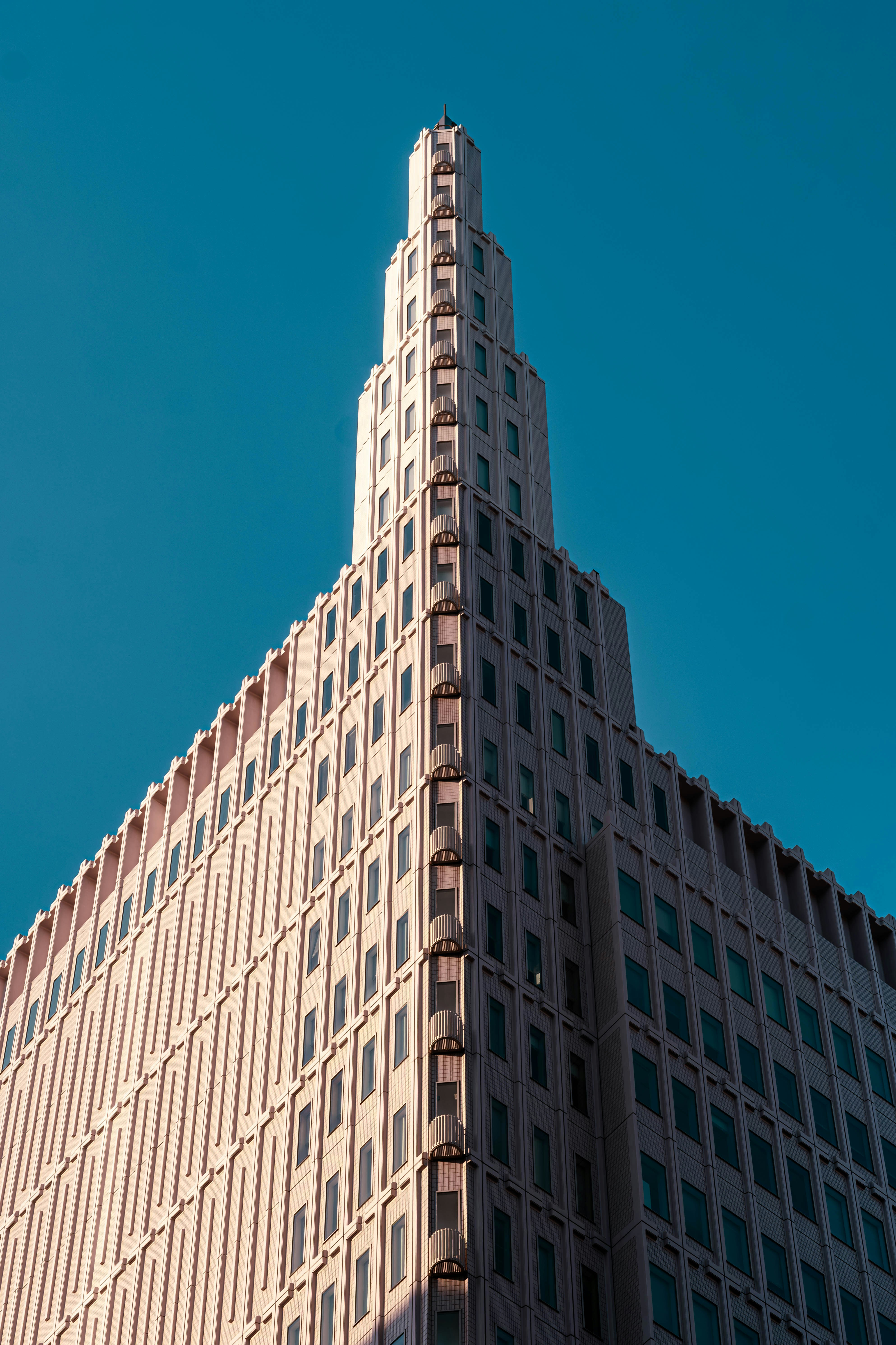 Modern skyscraper against a clear blue sky