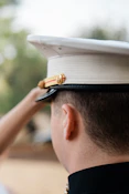 A person in a military uniform salutes