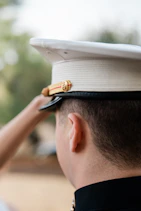 A person in a military uniform salutes