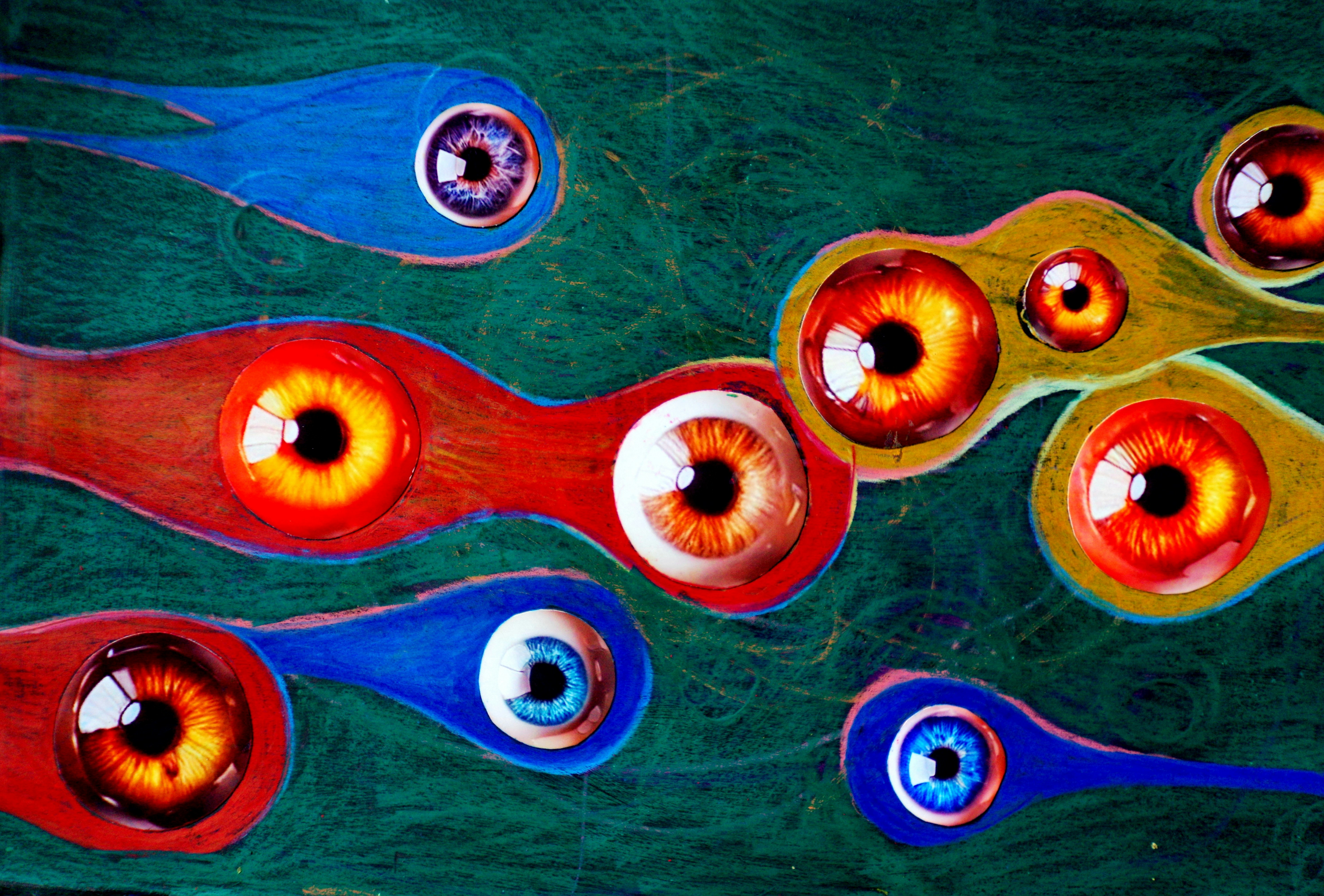 Abstract art with colorful shapes and human eyes