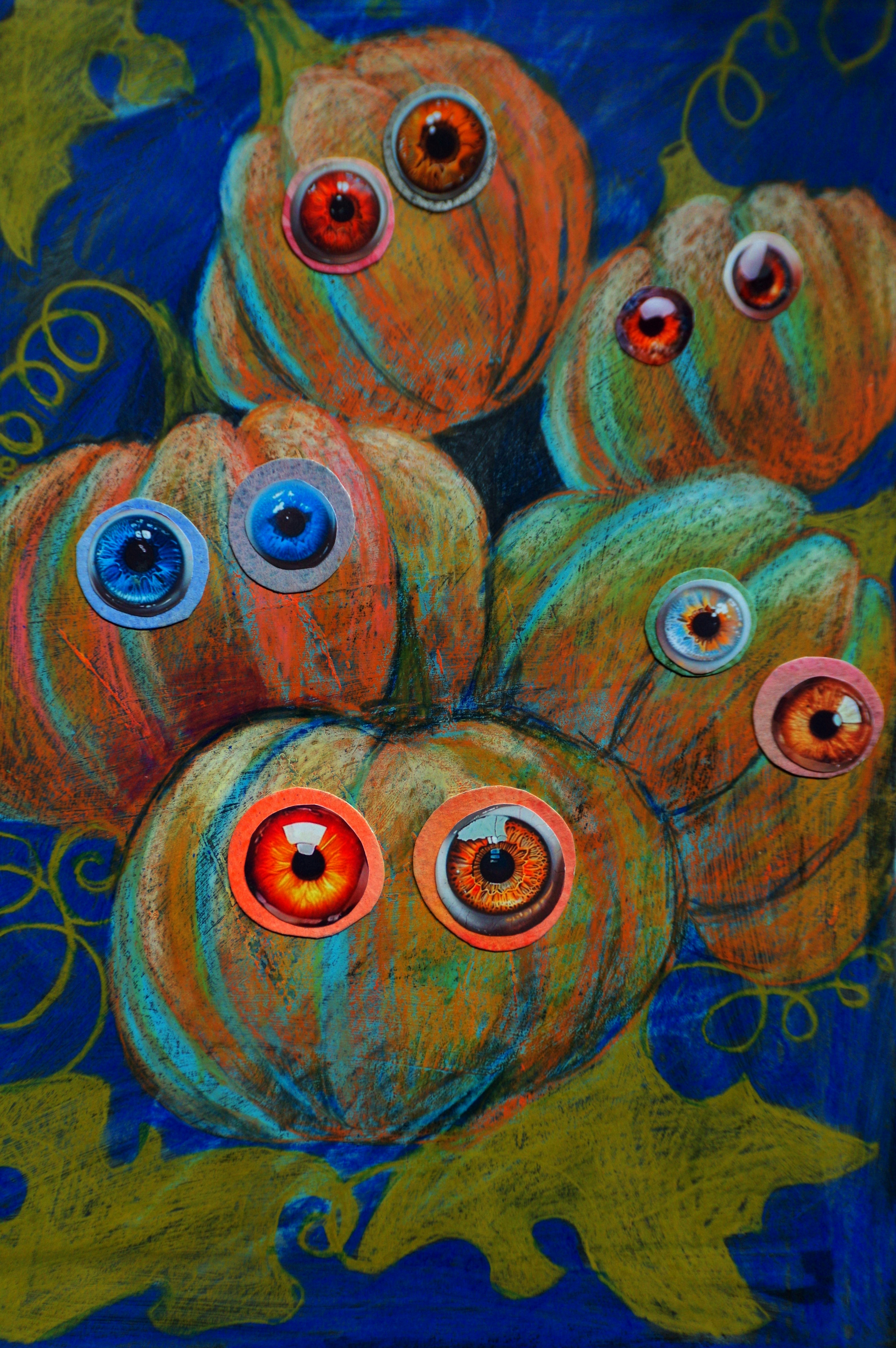 Several cartoon pumpkins with big eyes on blue background