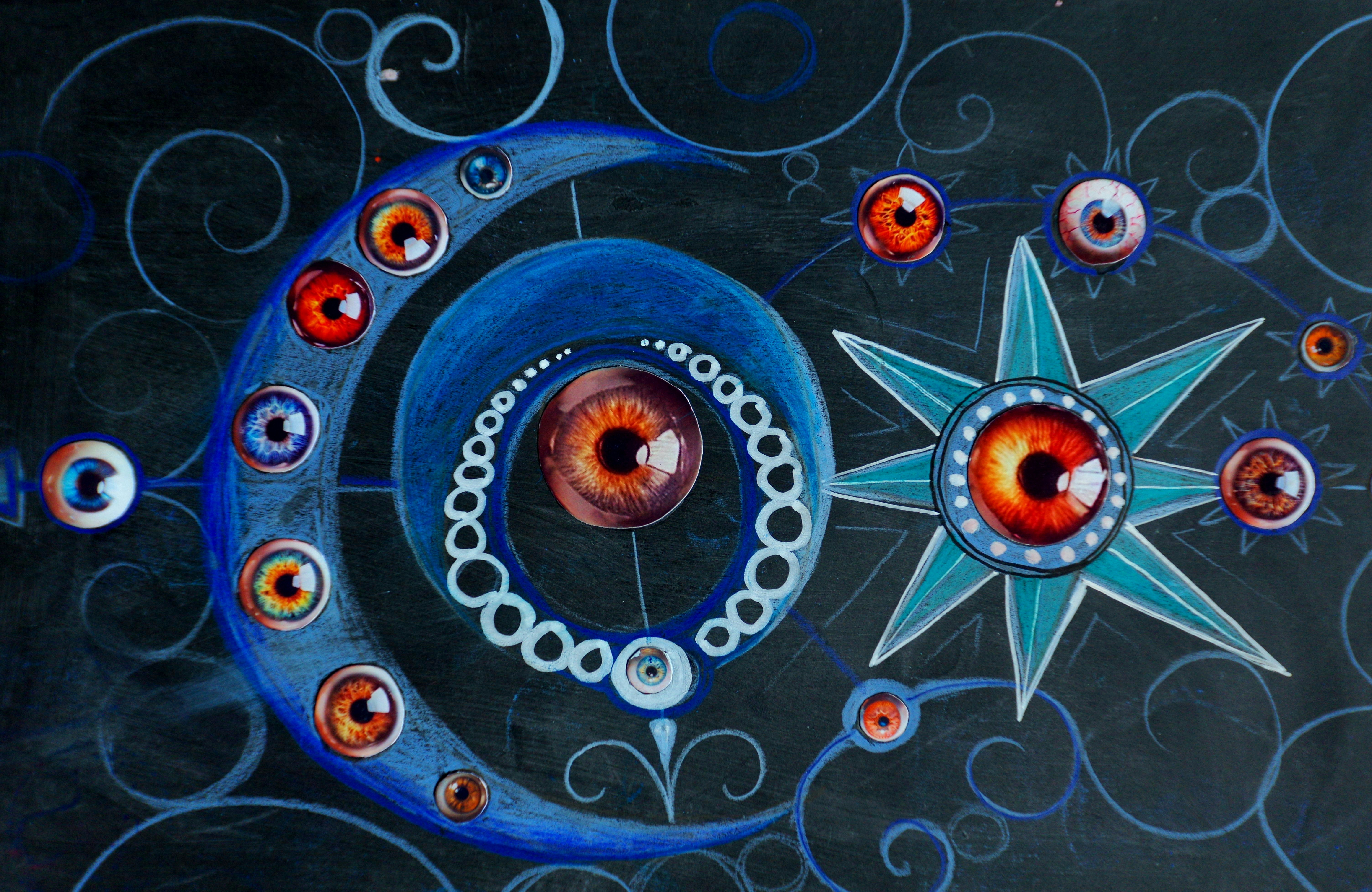 Surreal cosmic design with eyes and celestial bodies