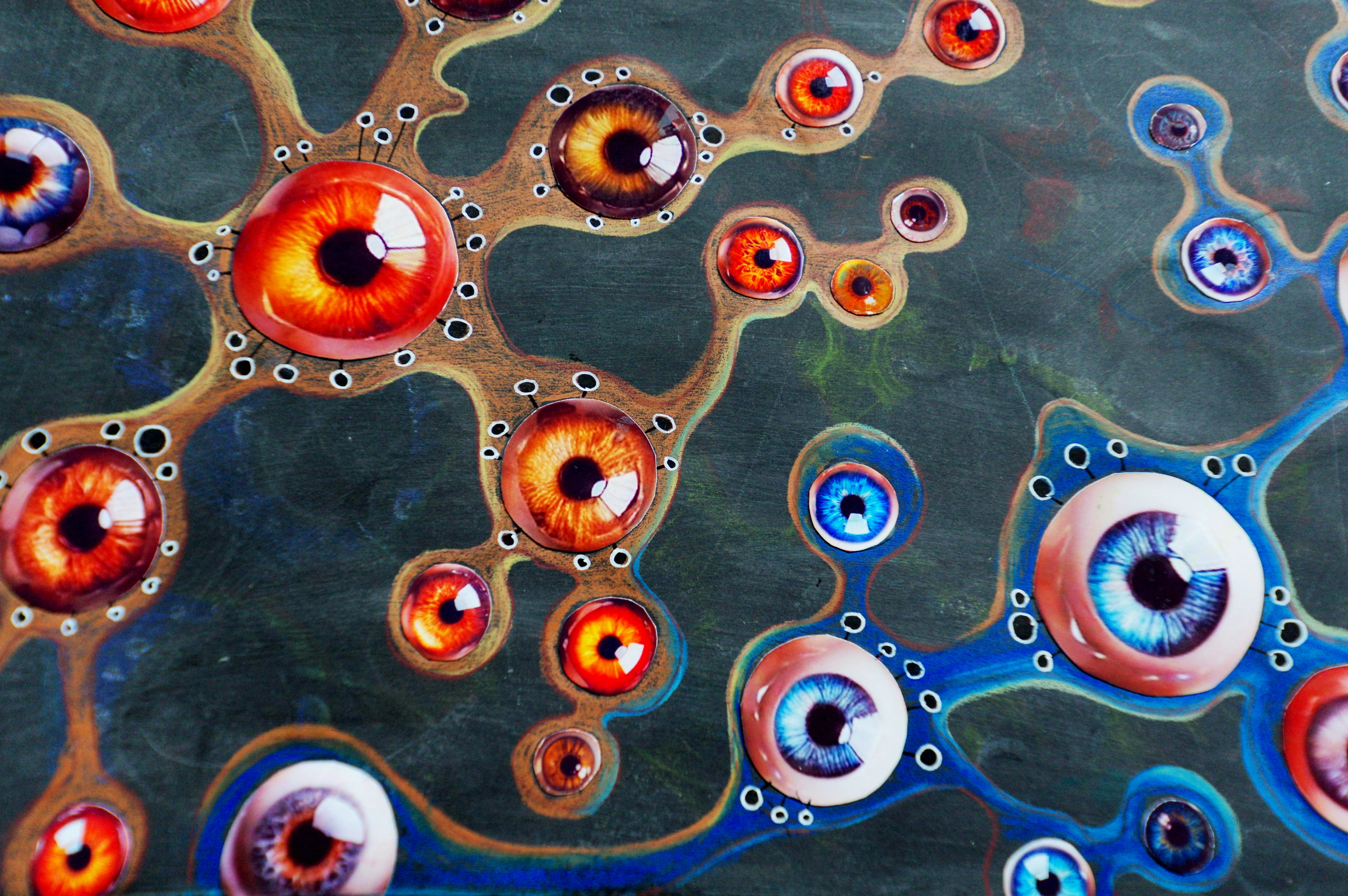 Abstract network of colorful eyes with detailed irises