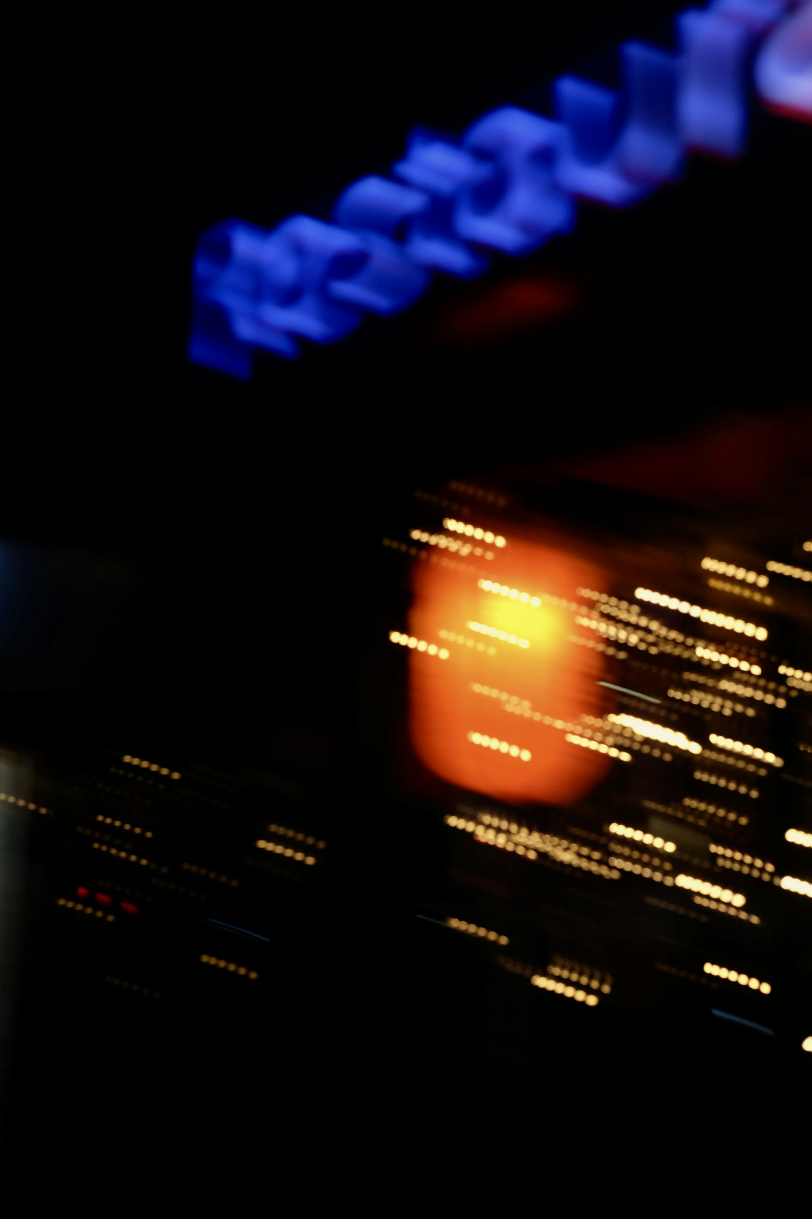 Abstract streaks of orange and blue lights at night