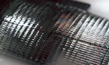 Close-up of a textured metallic surface with repeating patterns