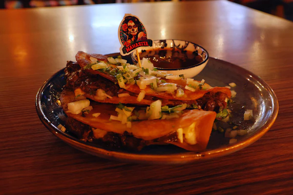 Birria tacos with rich braised beef and melted cheese