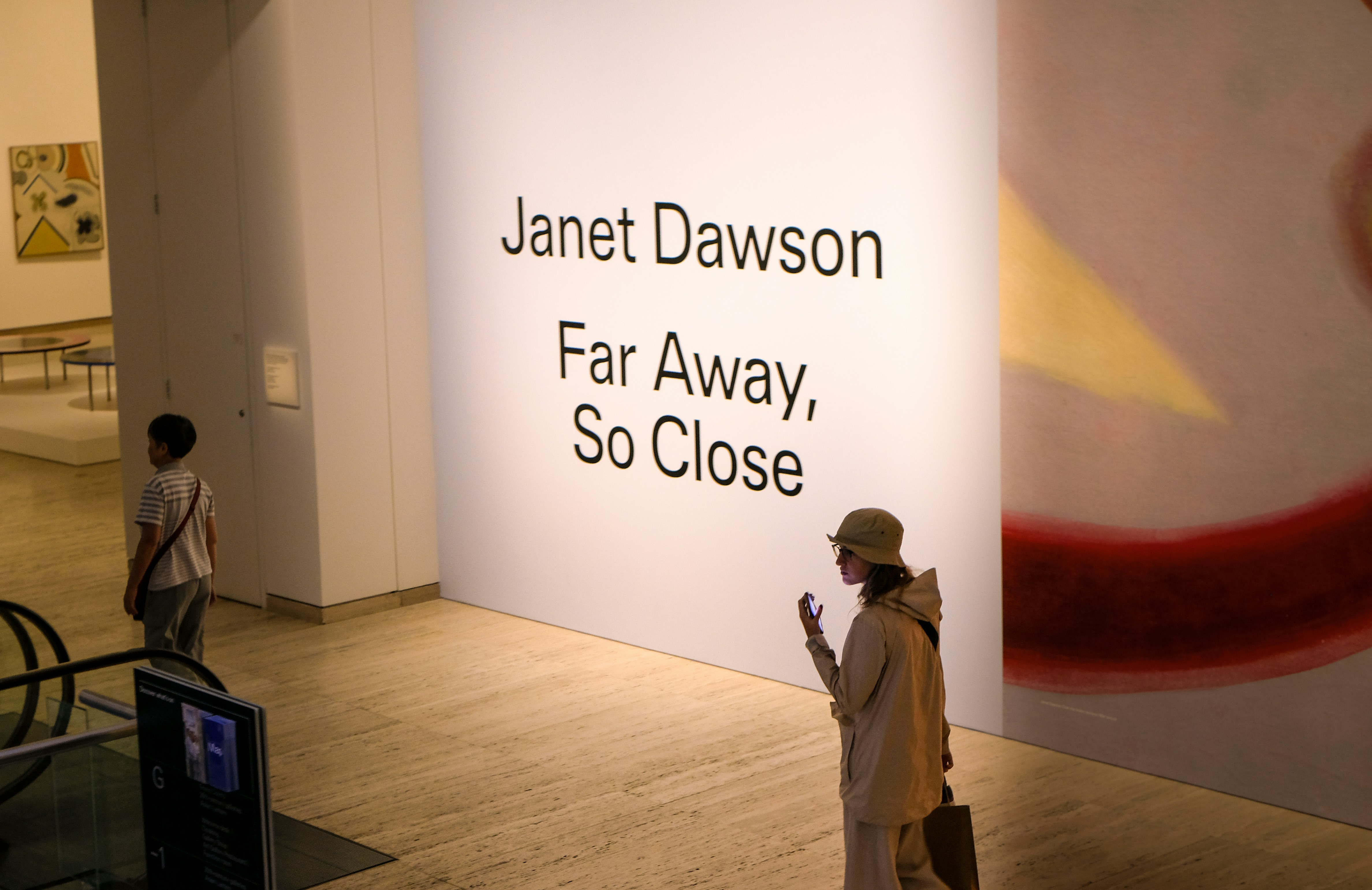 People in an art gallery looking at an exhibition