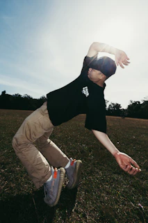 A man in mid-air with arms outstretched