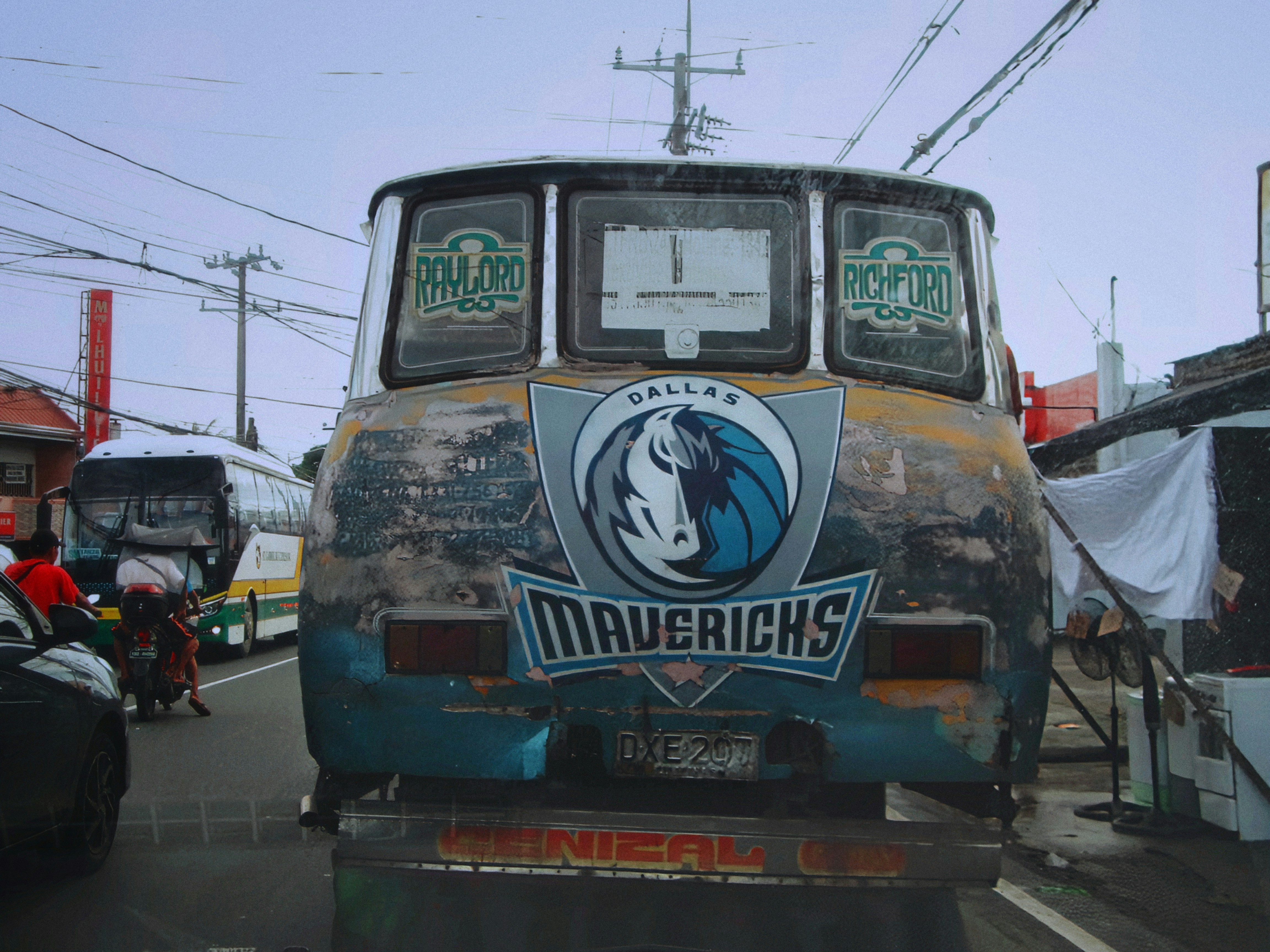 Old bus with mavericks logo on back