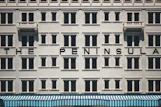 The peninsula hotel facade with many windows