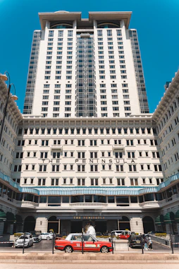 The peninsula hotel entrance with red taxi