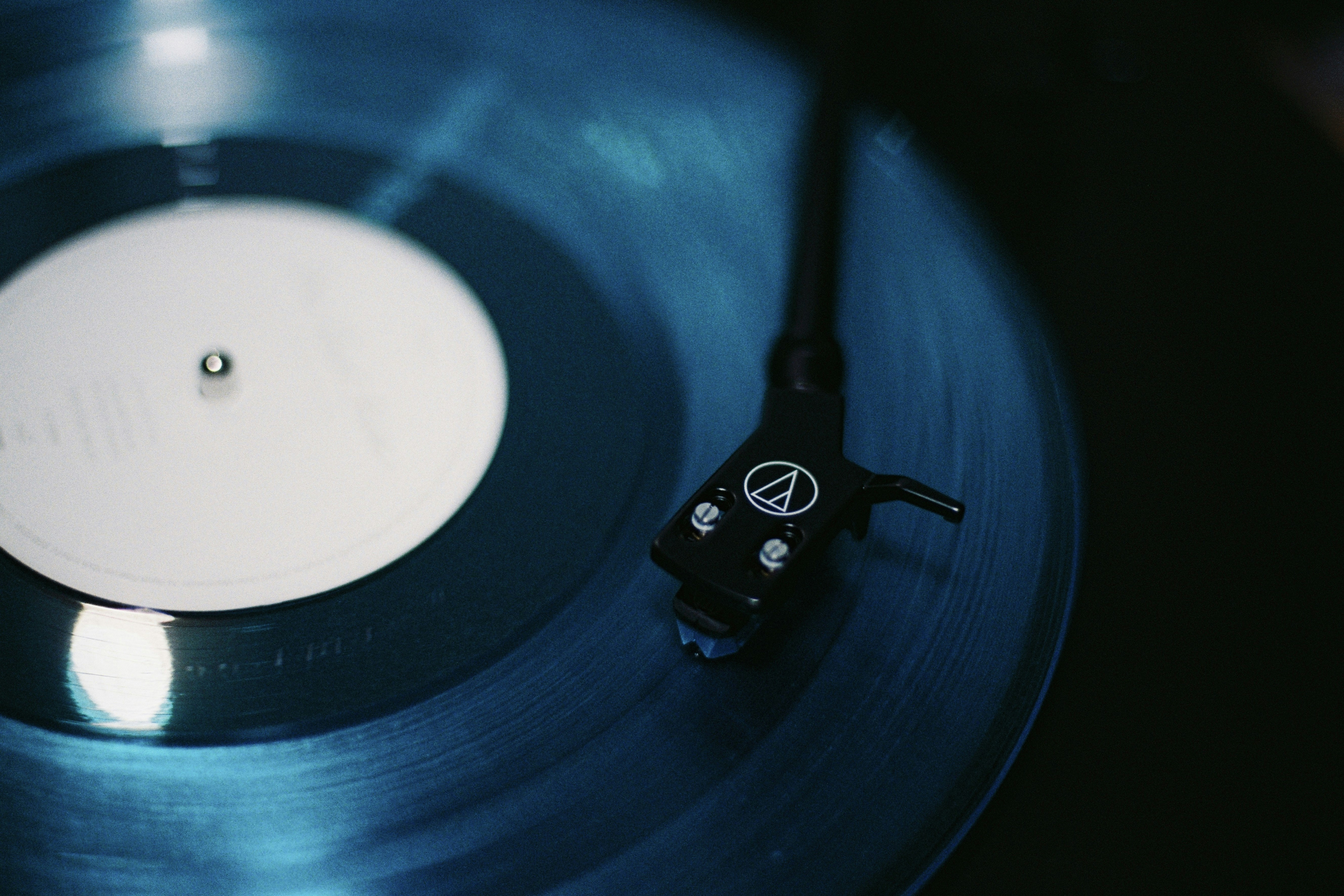 Close-up of a blue vinyl record playing