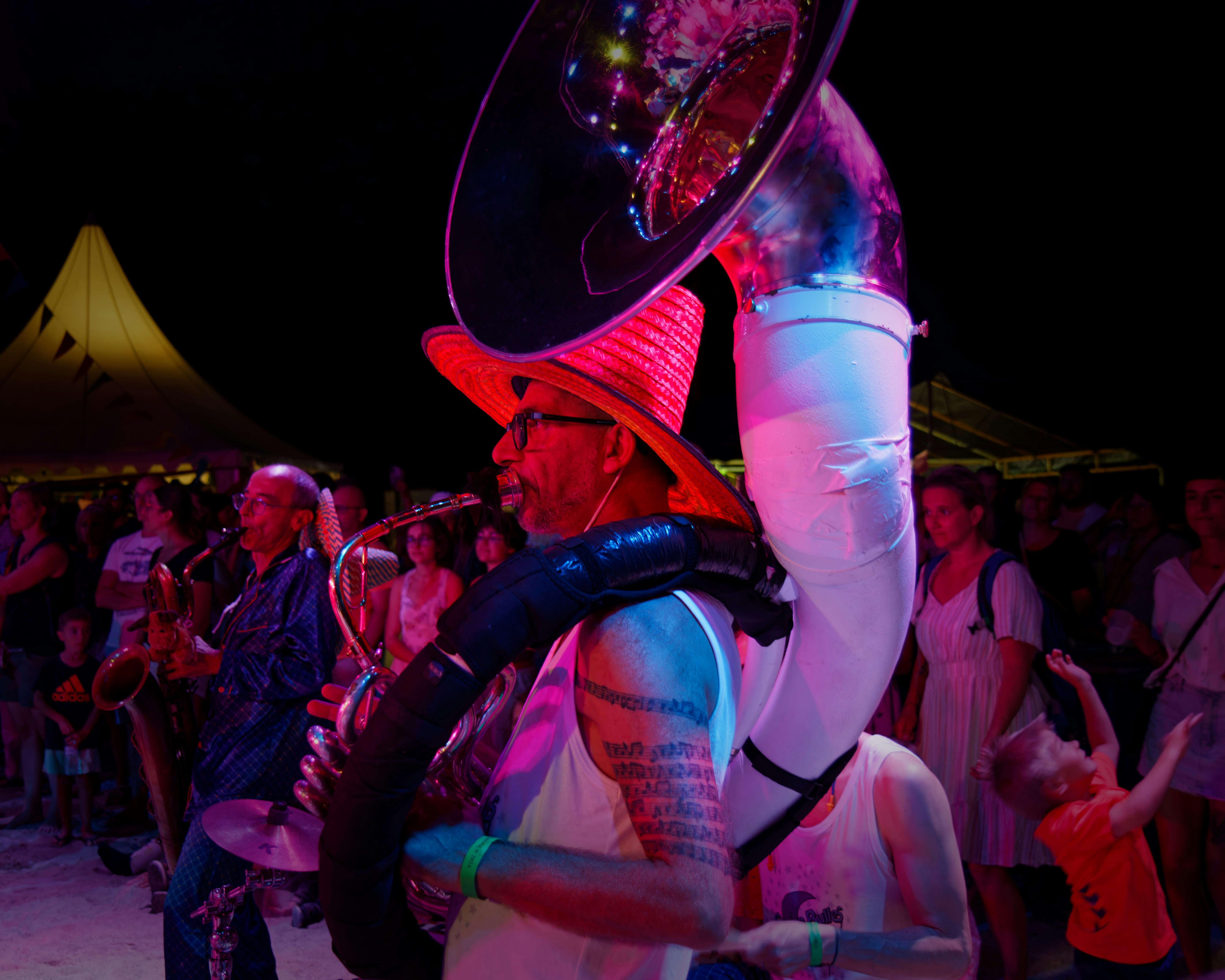 Musicians playing instruments at an outdoor event