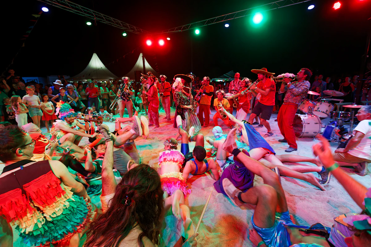 Colorful crowd dancing at a night festival