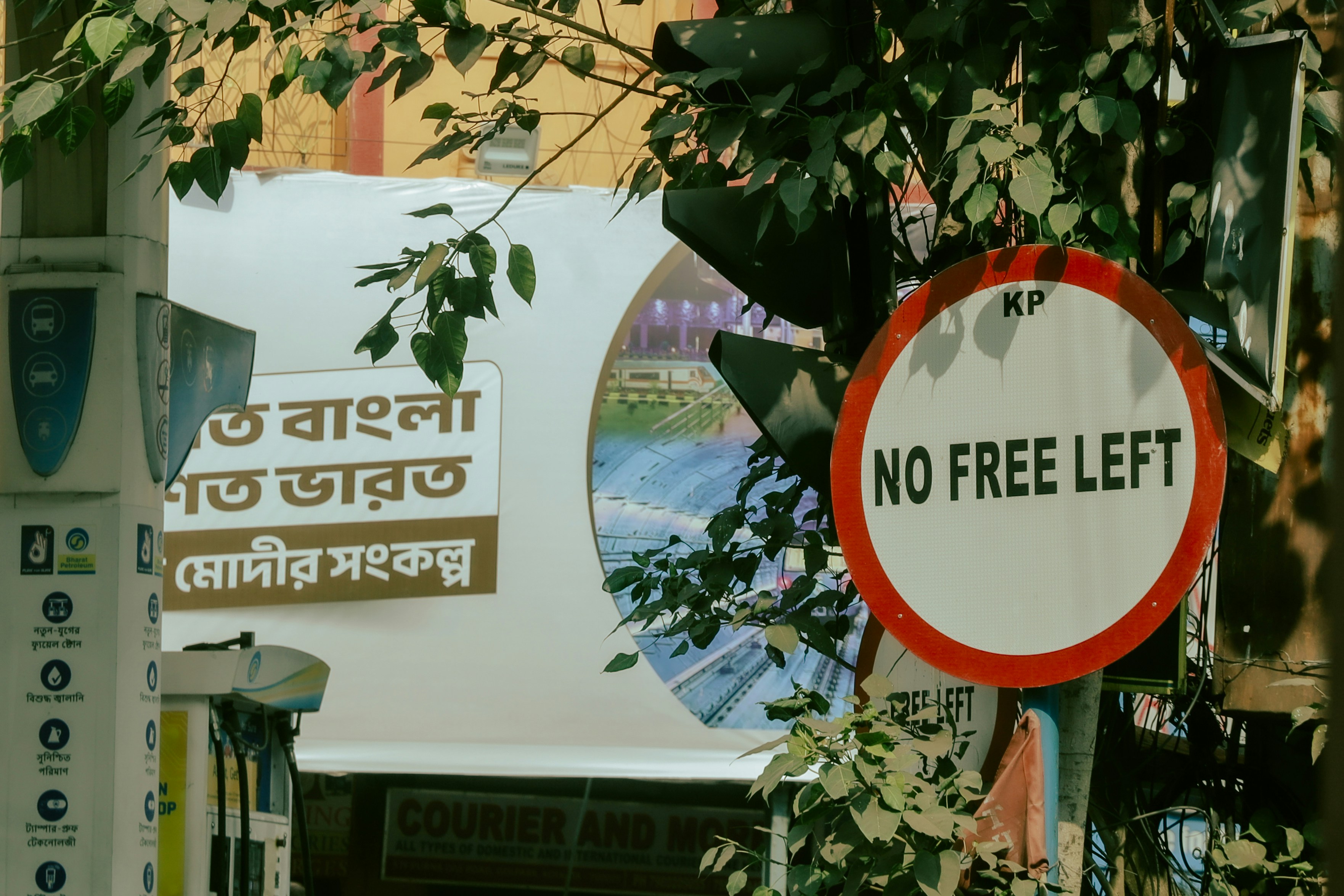 A protest rally in an Indian city, with people holding placards in Hindi expressing discontent over fuel prices. The crowd looks determined.