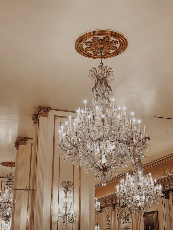 Elegant crystal chandeliers in ornate event venue