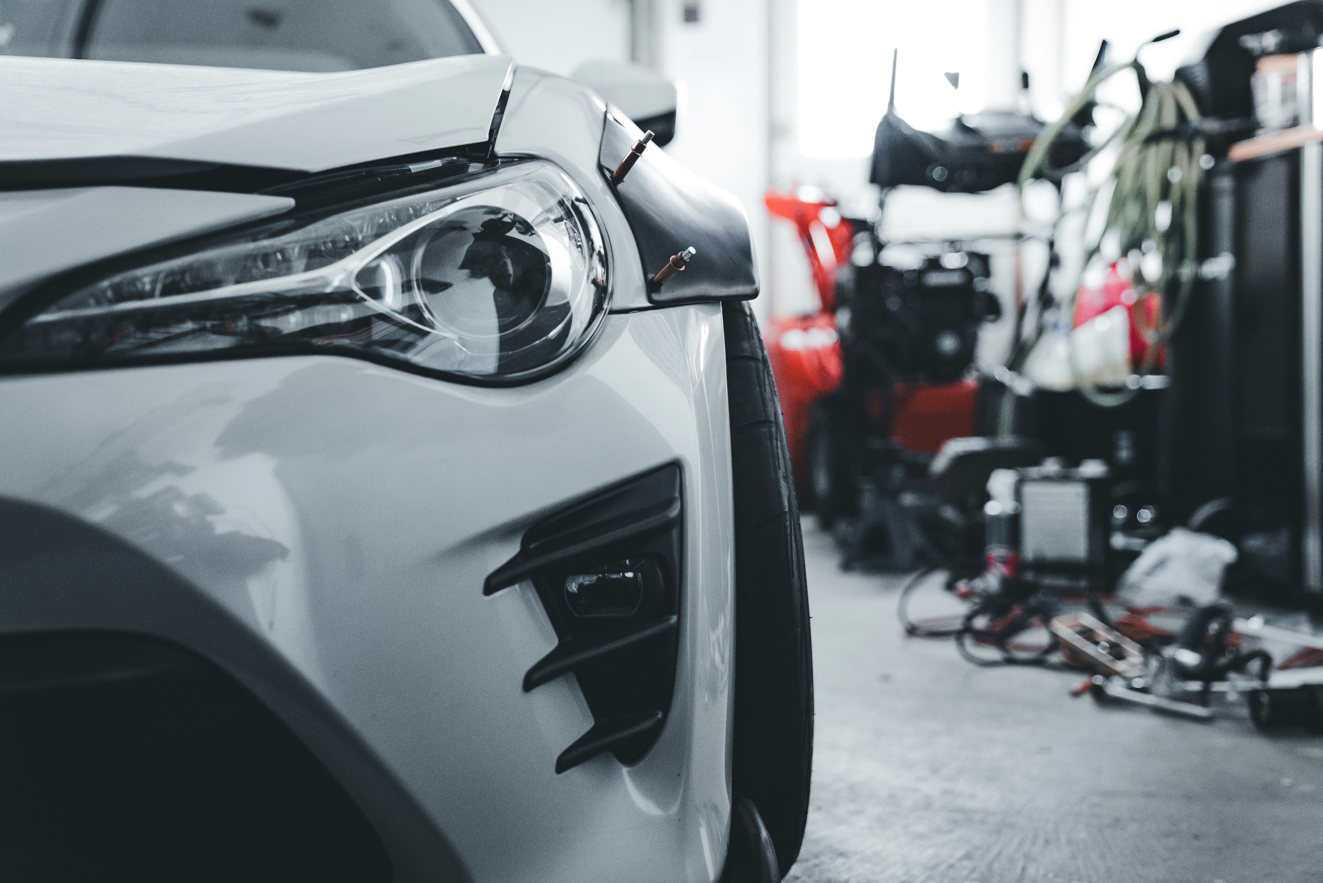 White sports car in a workshop