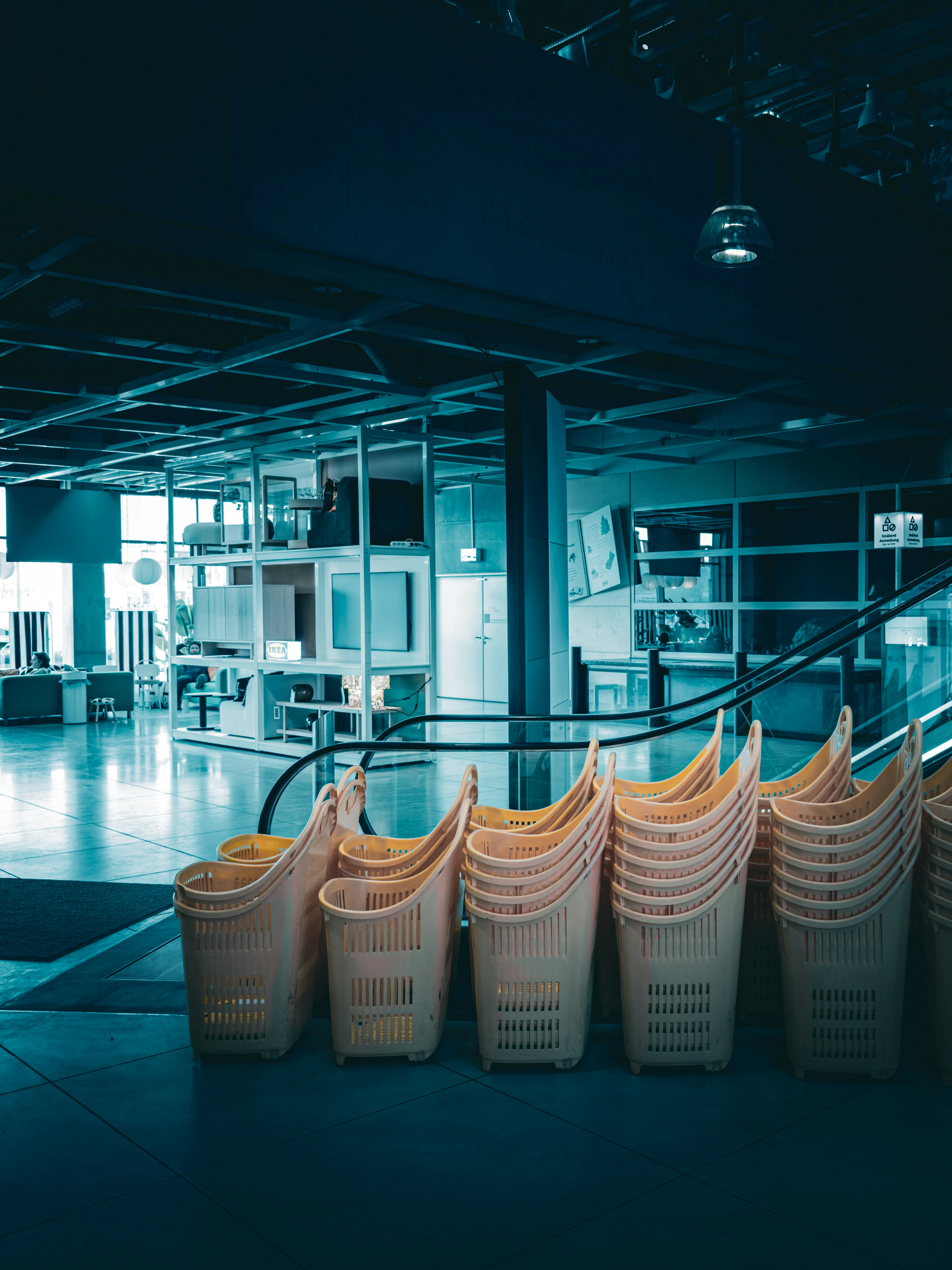 Stack of empty shopping baskets in a store