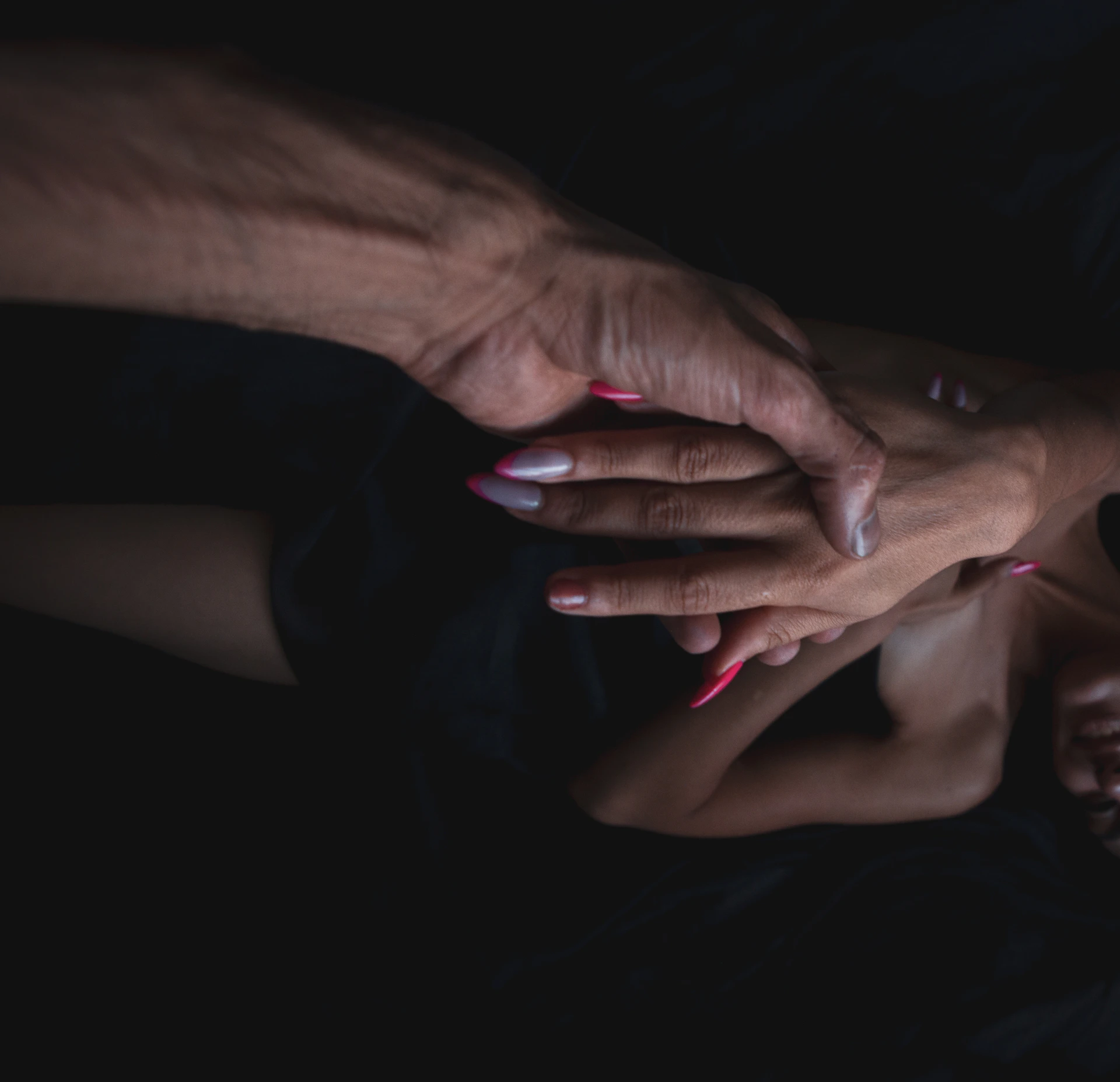 A hand holding another person's hand
