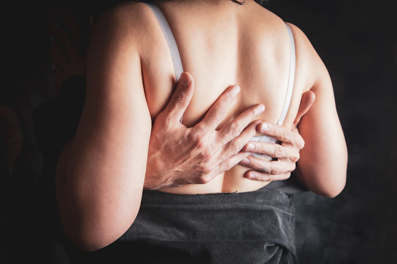 intimate embrace with hands around a woman's back