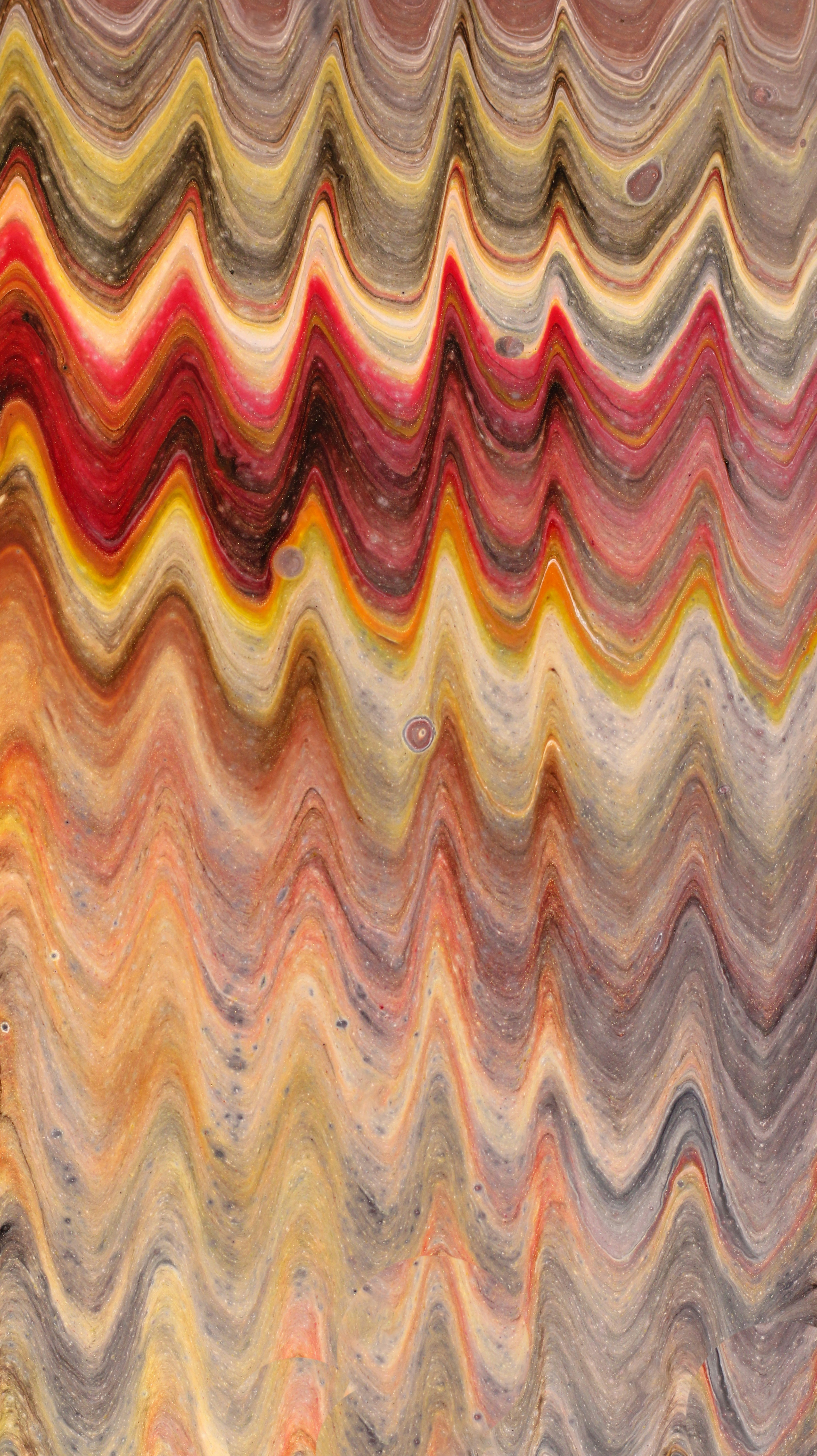 Wavy abstract pattern with red, yellow, and gray tones.