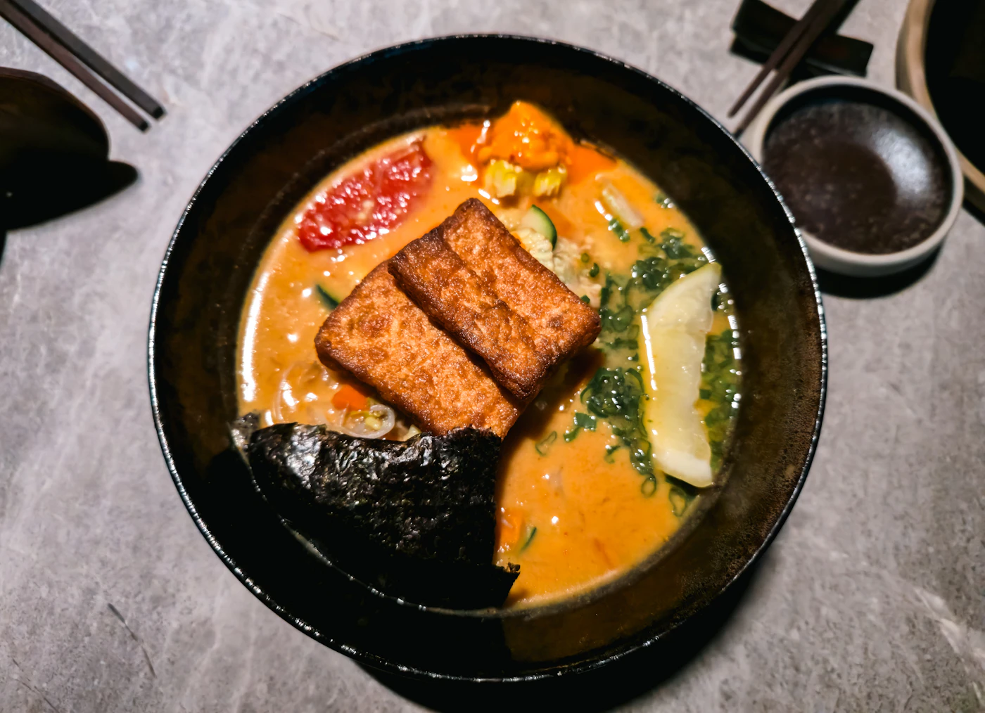 Tofu ramen in spicy coconut curry broth