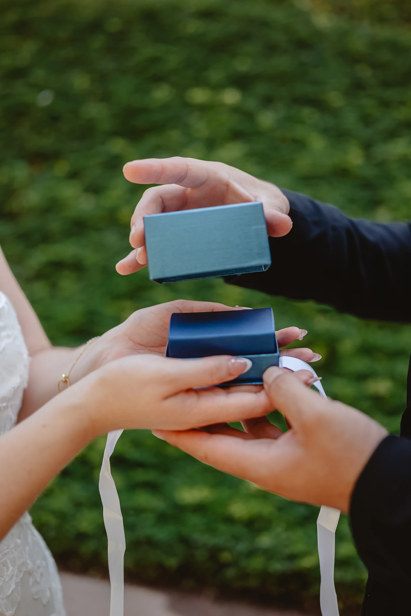 How to preserve your wedding dress after the ceremony — A bride gently handling her wedding gown to remove wrinkles.