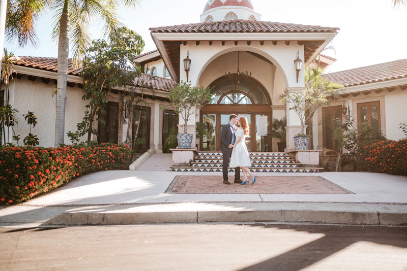 elegant couple outside a luxury building