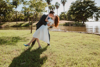 Couple kissing by a lake during a dip