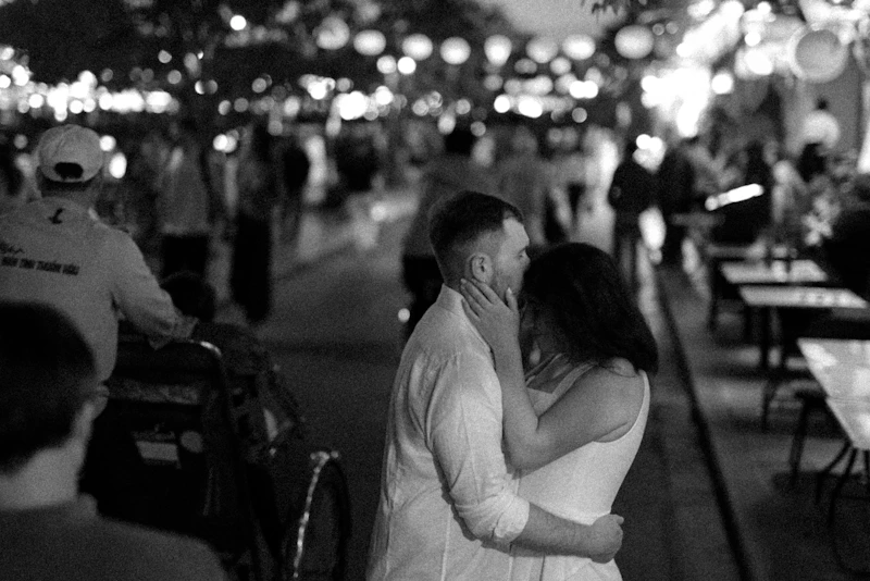 Couple embracing on a vibrant city street