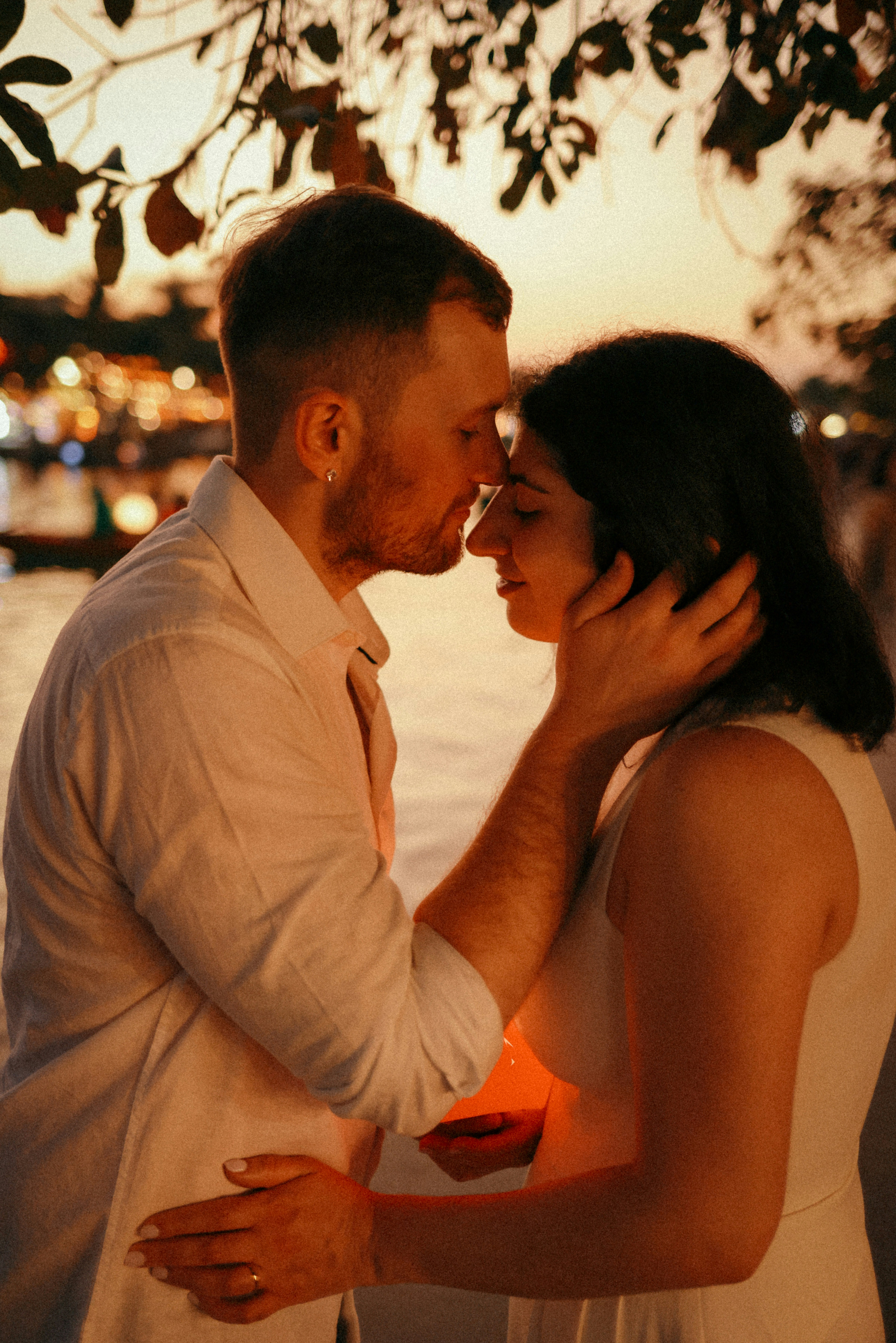 Couple embracing during a warm sunset