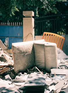 Debris and large wrapped objects in a construction site.