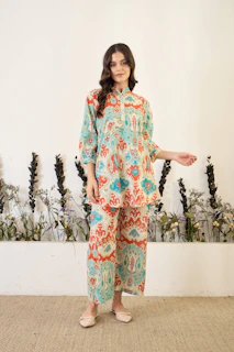 Woman in patterned tunic and pants
