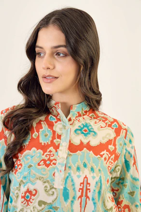 A woman in a colorful patterned kurta