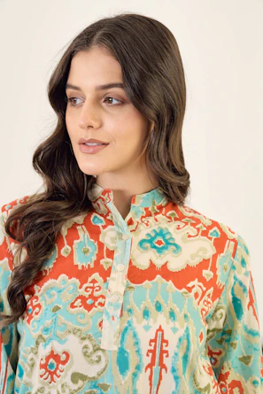 A woman in a colorful patterned kurta