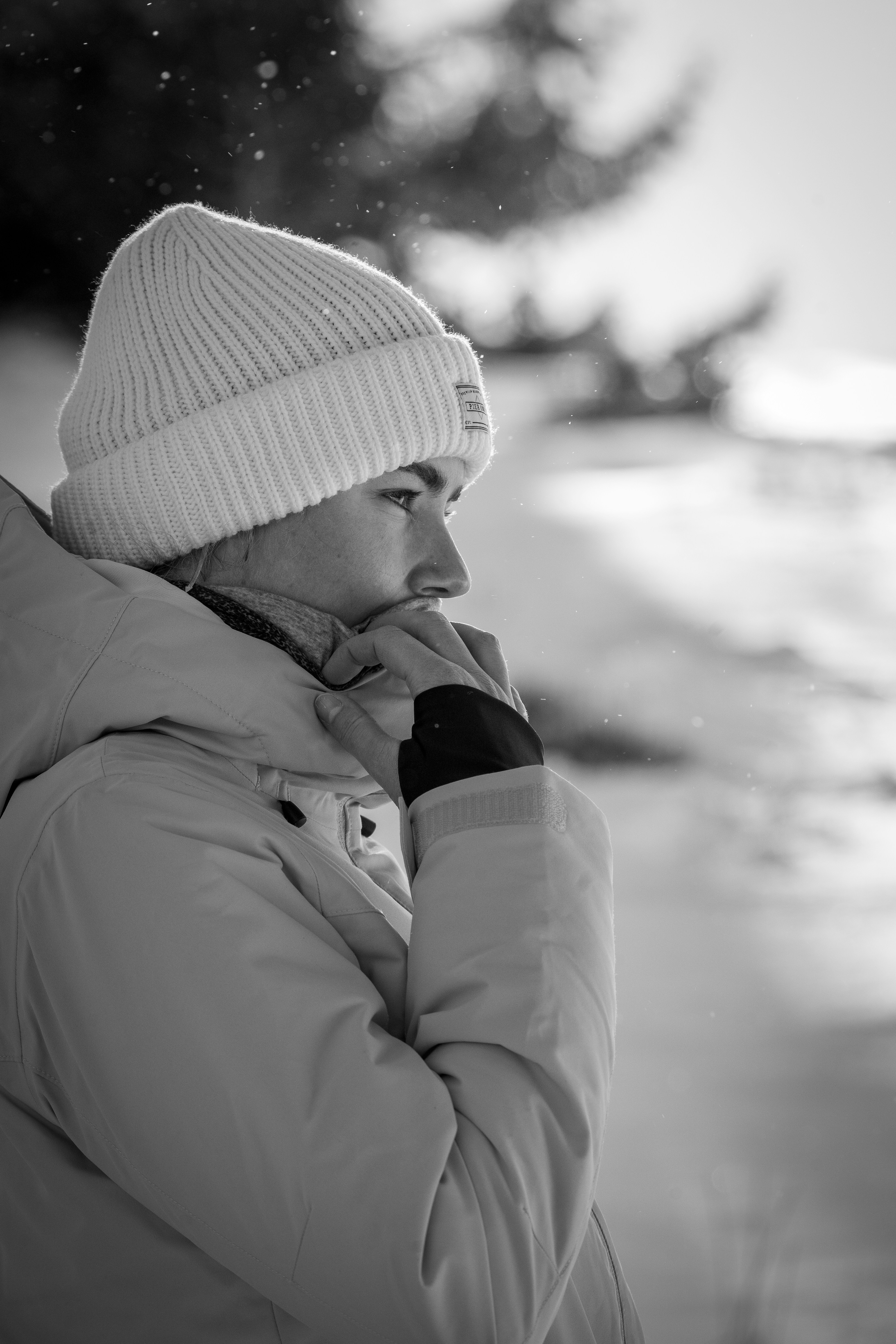 Young woman in winter clothing looking into the distance