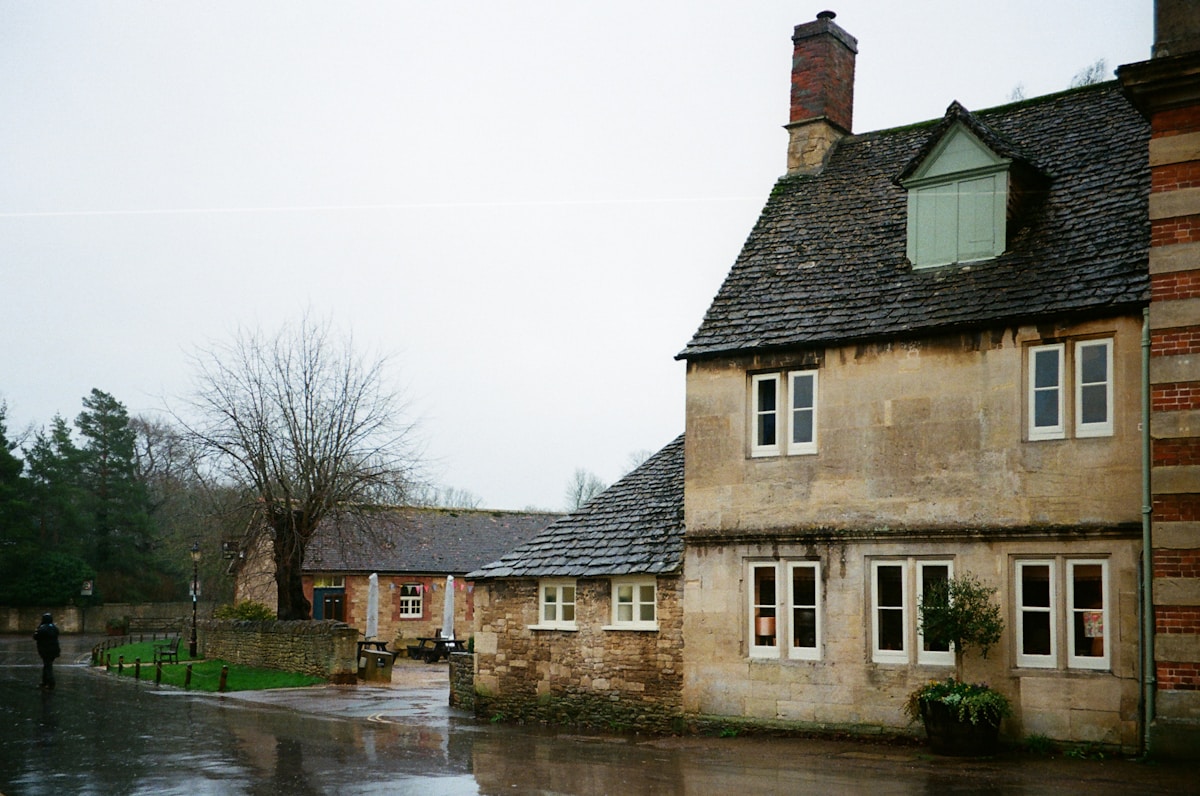Old stone buildings on a wet, overcast day