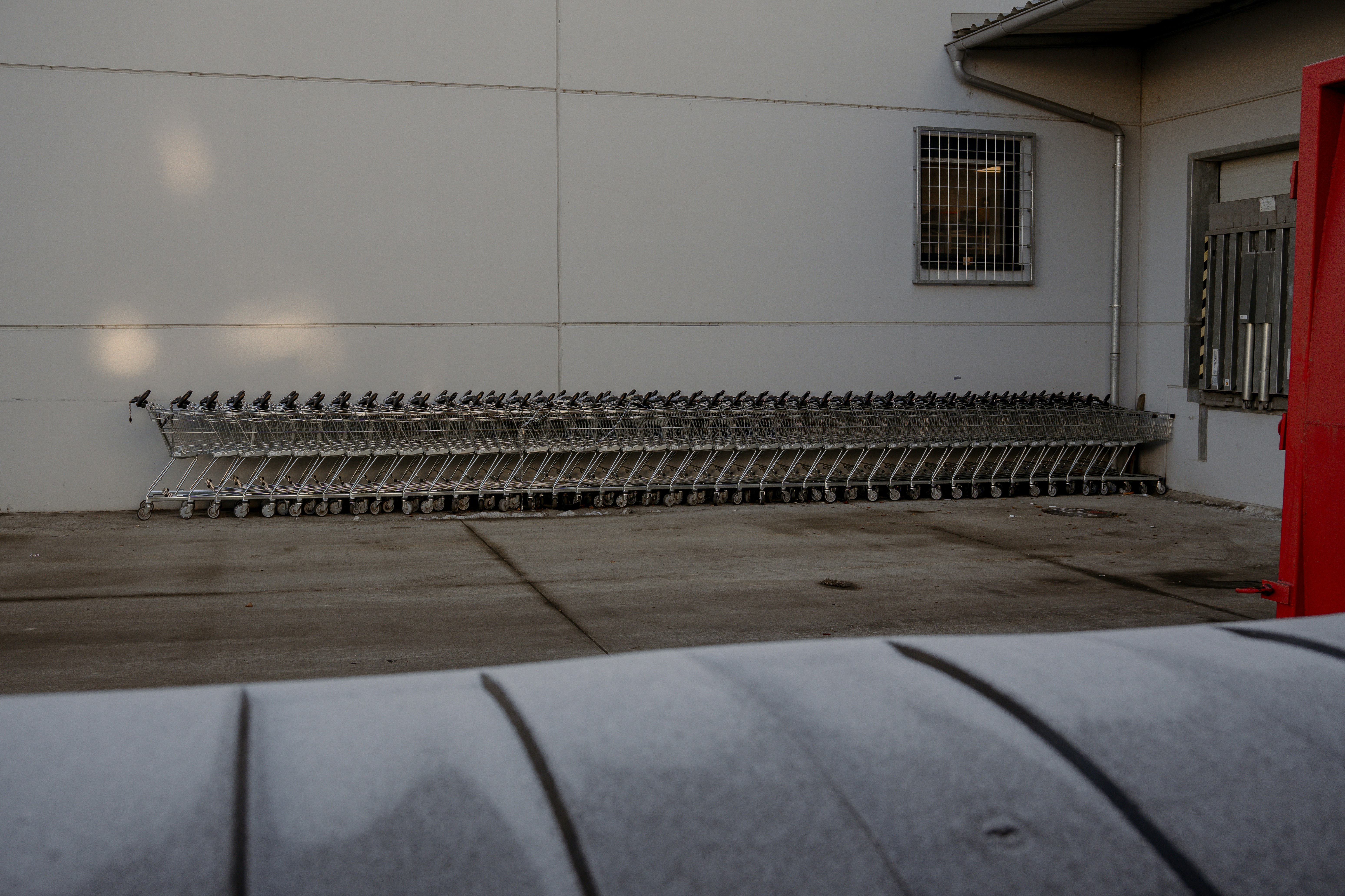 Shopping carts lined up outside a building