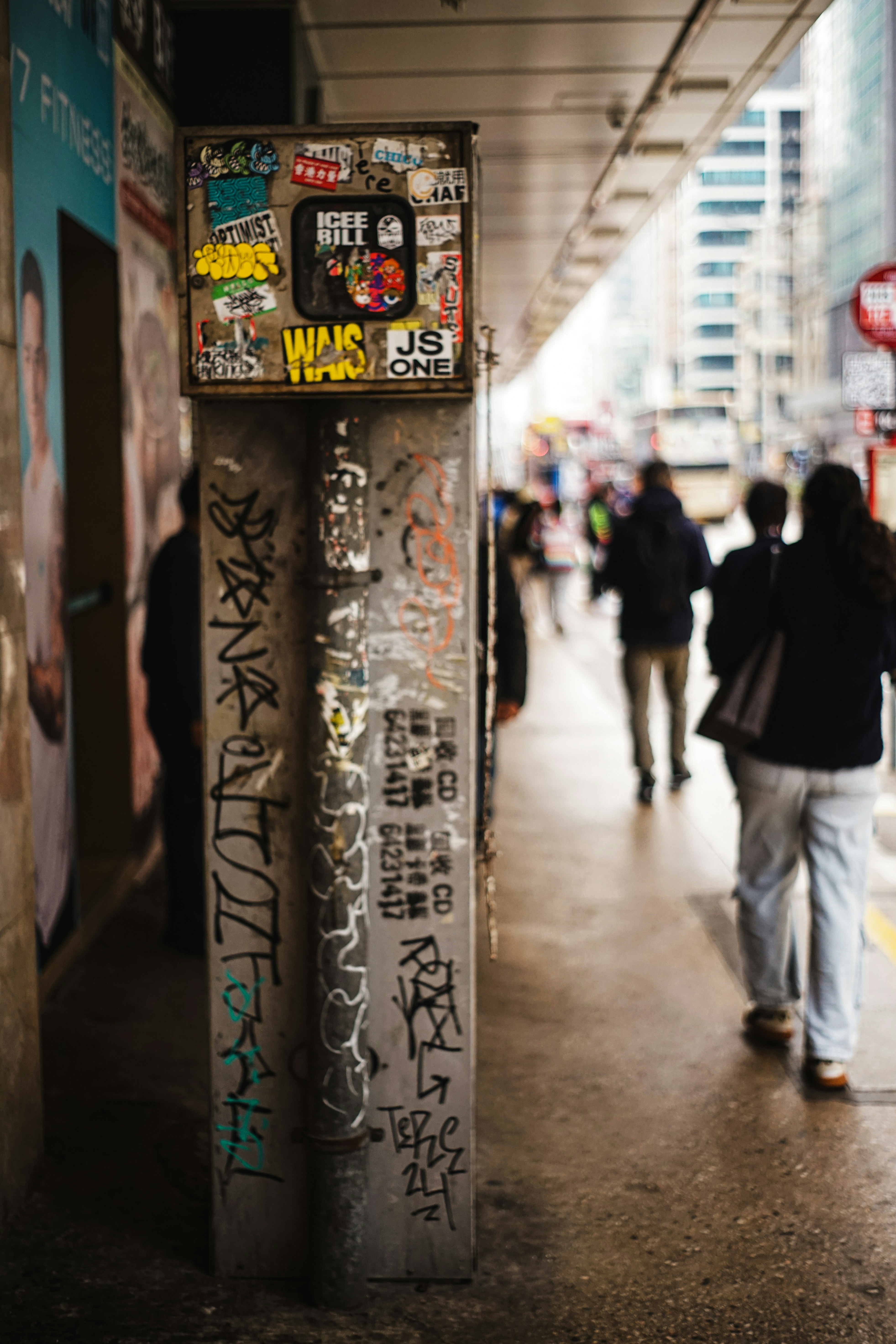 Graffiti-covered utility box on a city street