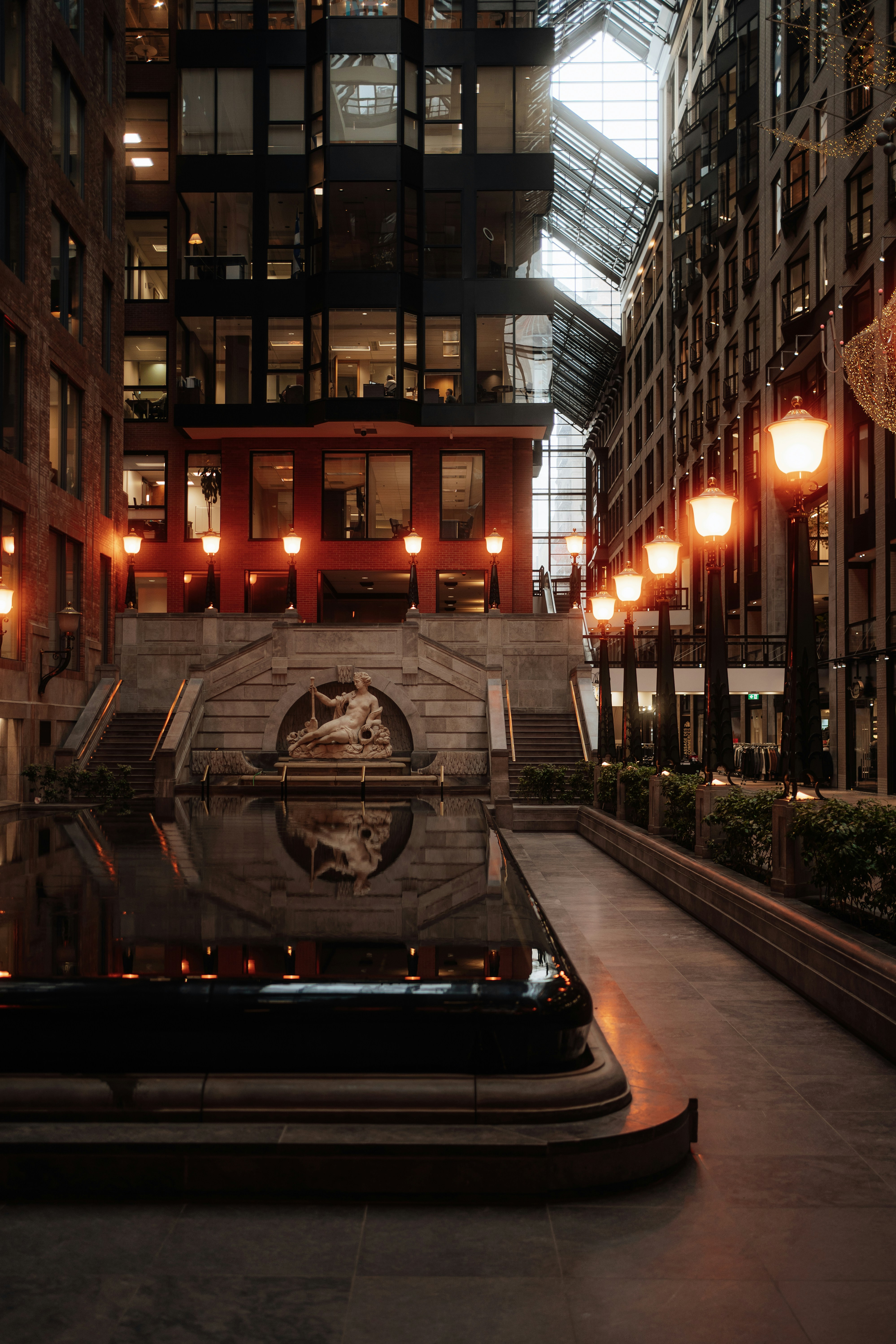 Indoor courtyard with ornate lamps and fountain