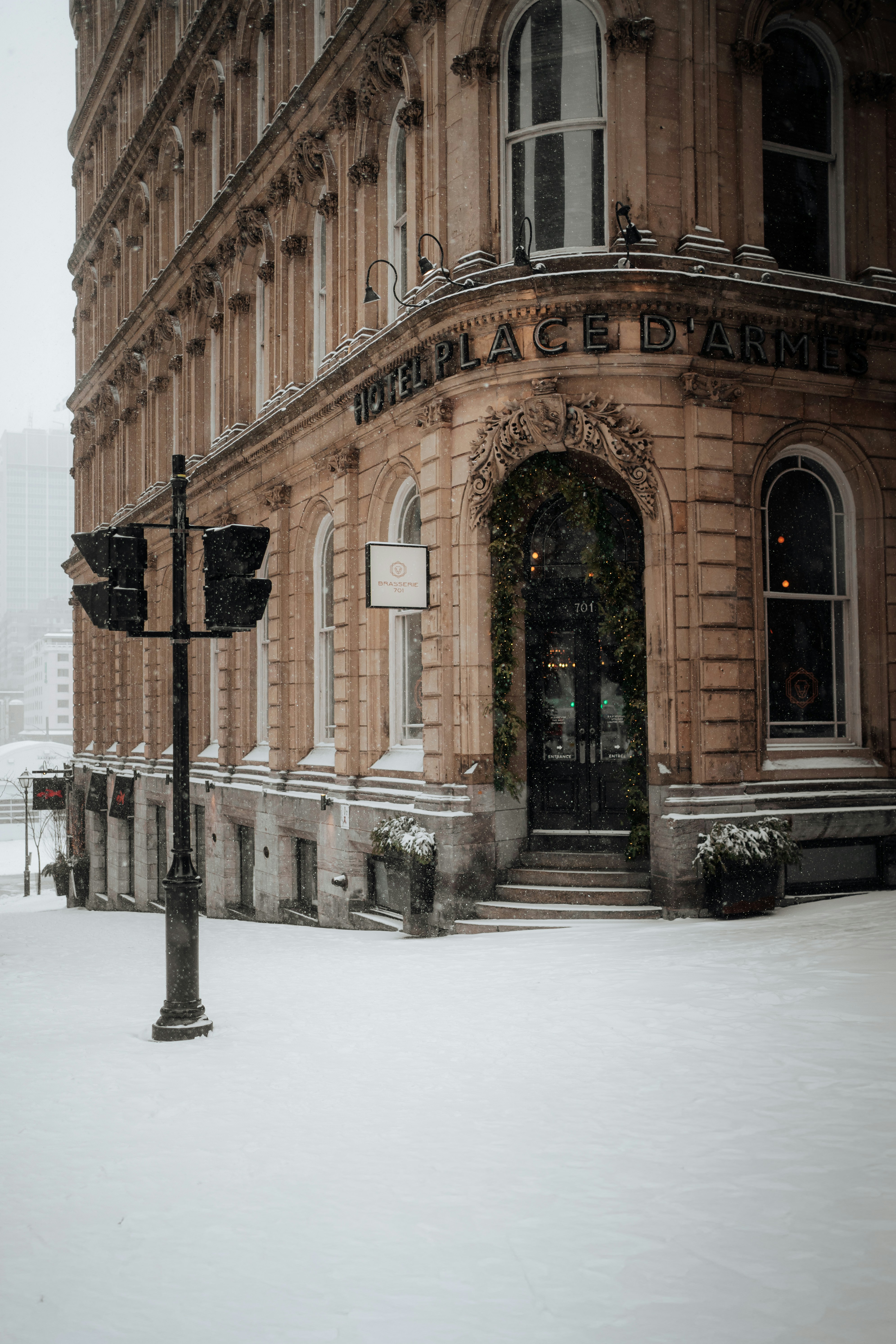 Historic building entrance covered in snow during winter