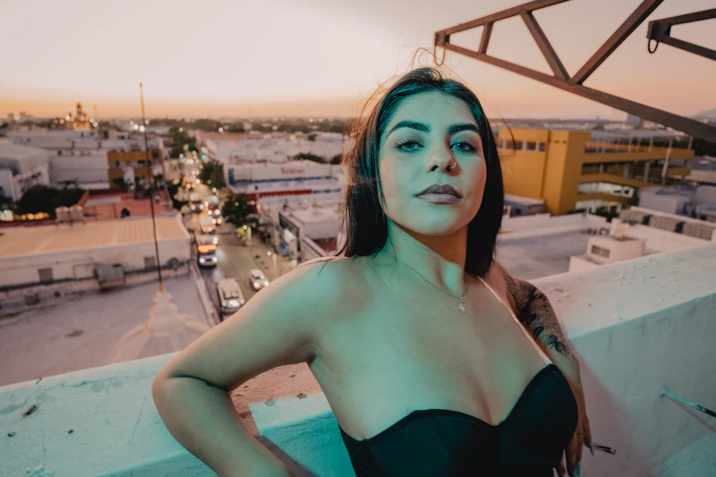 Dreamy Australian sugar mummy on a rooftop overlooking the city at sunset