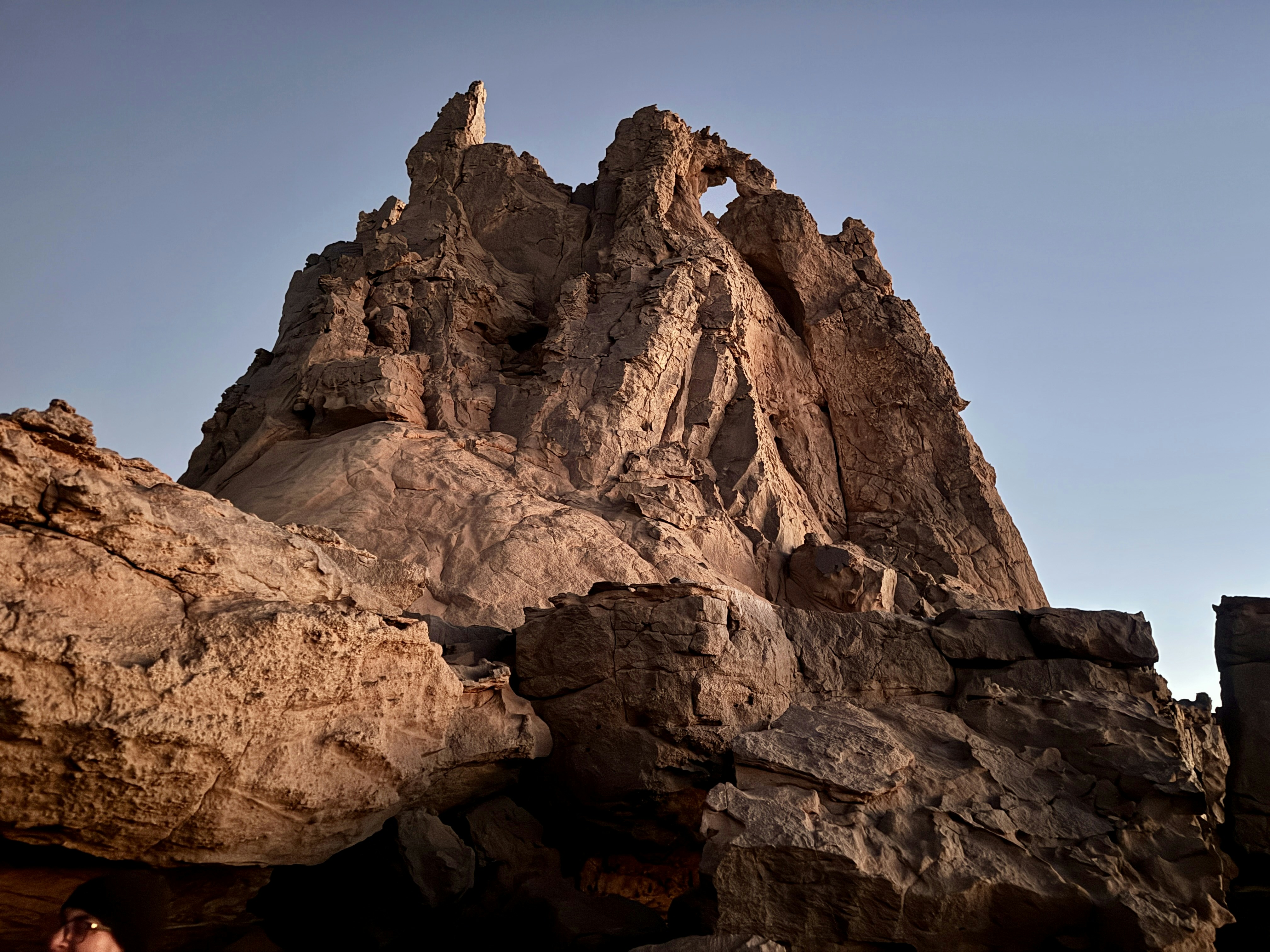 Jagged rock formations against a clear blue sky