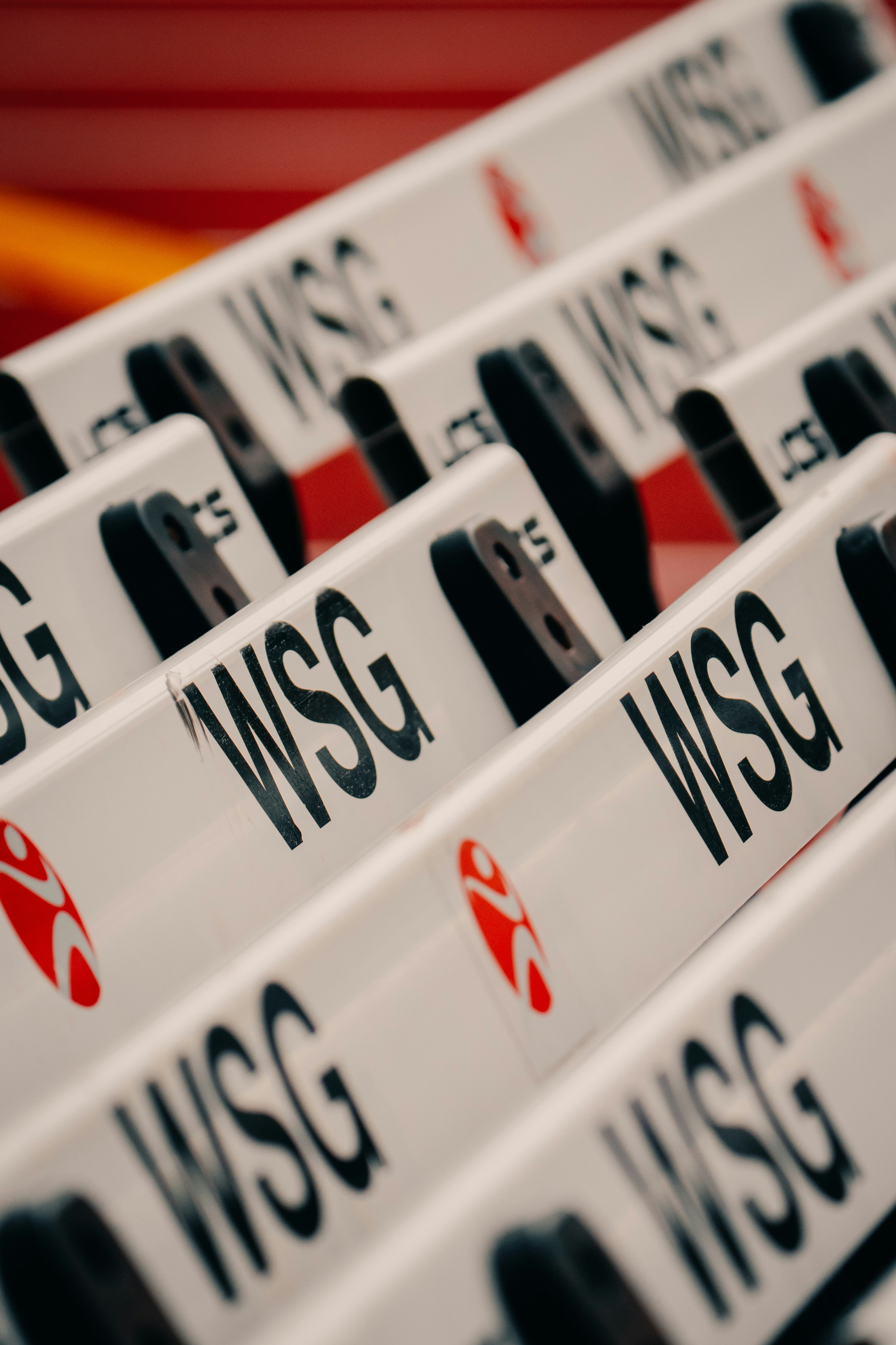 White hurdles lined up on a track